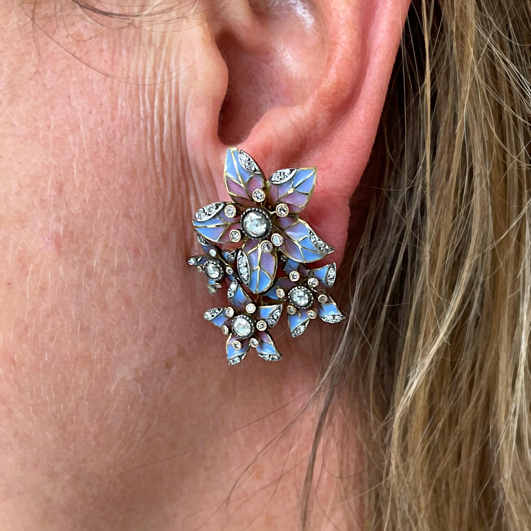 A pair of flower earrings, each with four, five petalled, flower heads, with blue and pink plique à jour enamel and rose-cut and eight-cut diamonds, in millegrain edged, rub over and grain settings, mounted in 18ct gold, with some silver settings,