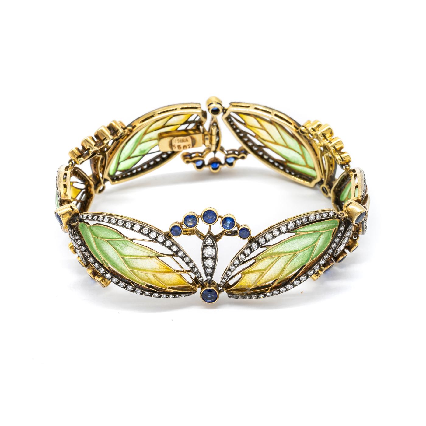 A Moira wheat and seed heads bracelet, with yellow to green plique à jour enamel, set with sapphires and eight-cut diamonds, mounted in gold, with silver settings.