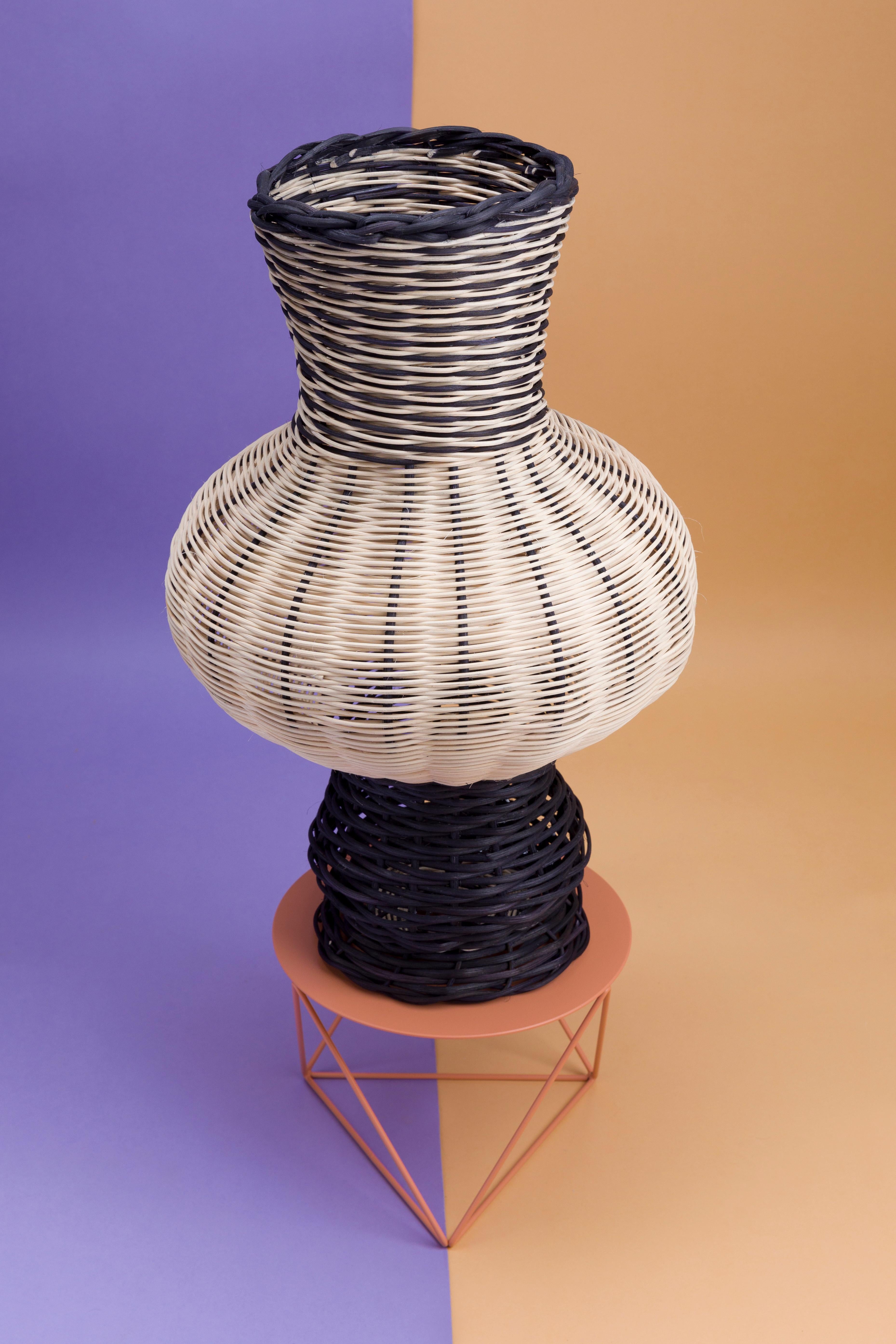The Moira Vase is a one-of-a-kind objet d’art, hand dyed and woven with reed in our Chicago studio. Inspired by forms in ancient Greek ceramics, the material language of this vessel brings together the rich craft history of weaving with 3