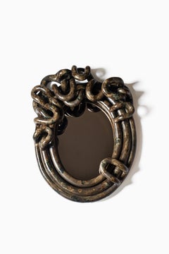 Espejo autorretrato de gres esmaltado moaré marrón-bronce de Clémentine Dupré.