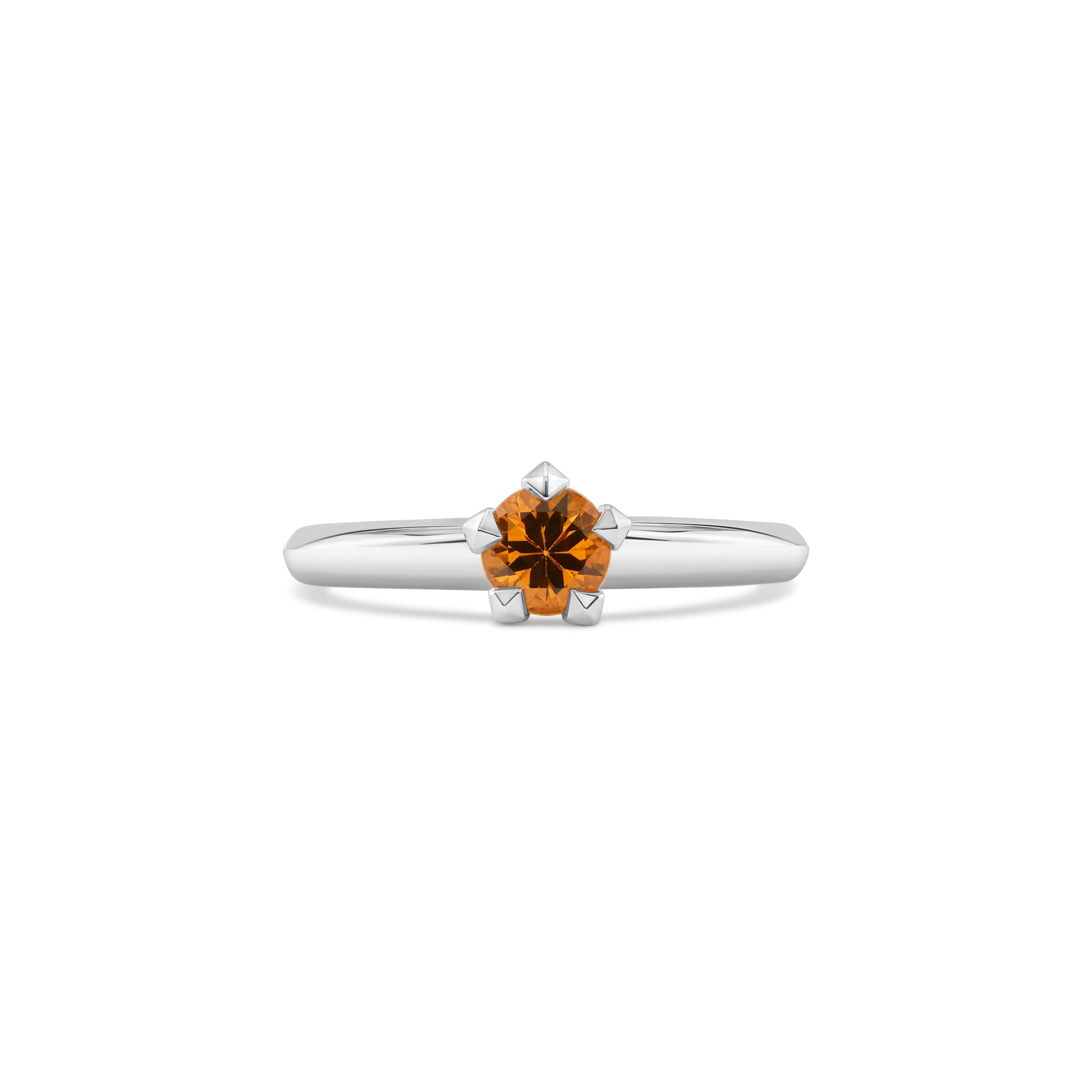 Made in luminous white gold, this yellow sapphire ring from MOISEIKIN captures the essence of starlight with its delicate design and detail.
A radiant 0.68ct central yellow sapphire, a dazzling beacon of warmth and light, is cradled within star-like