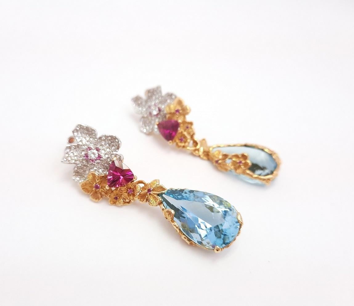 Inspired by Impressionism, MOISEIKIN® has created a blooming flower earrings  in tridimensional manner. Trembling flowers and sweet fragrance of coming ripe fruits are embodied  in gems and metals. Under the lively flower petals embedded with