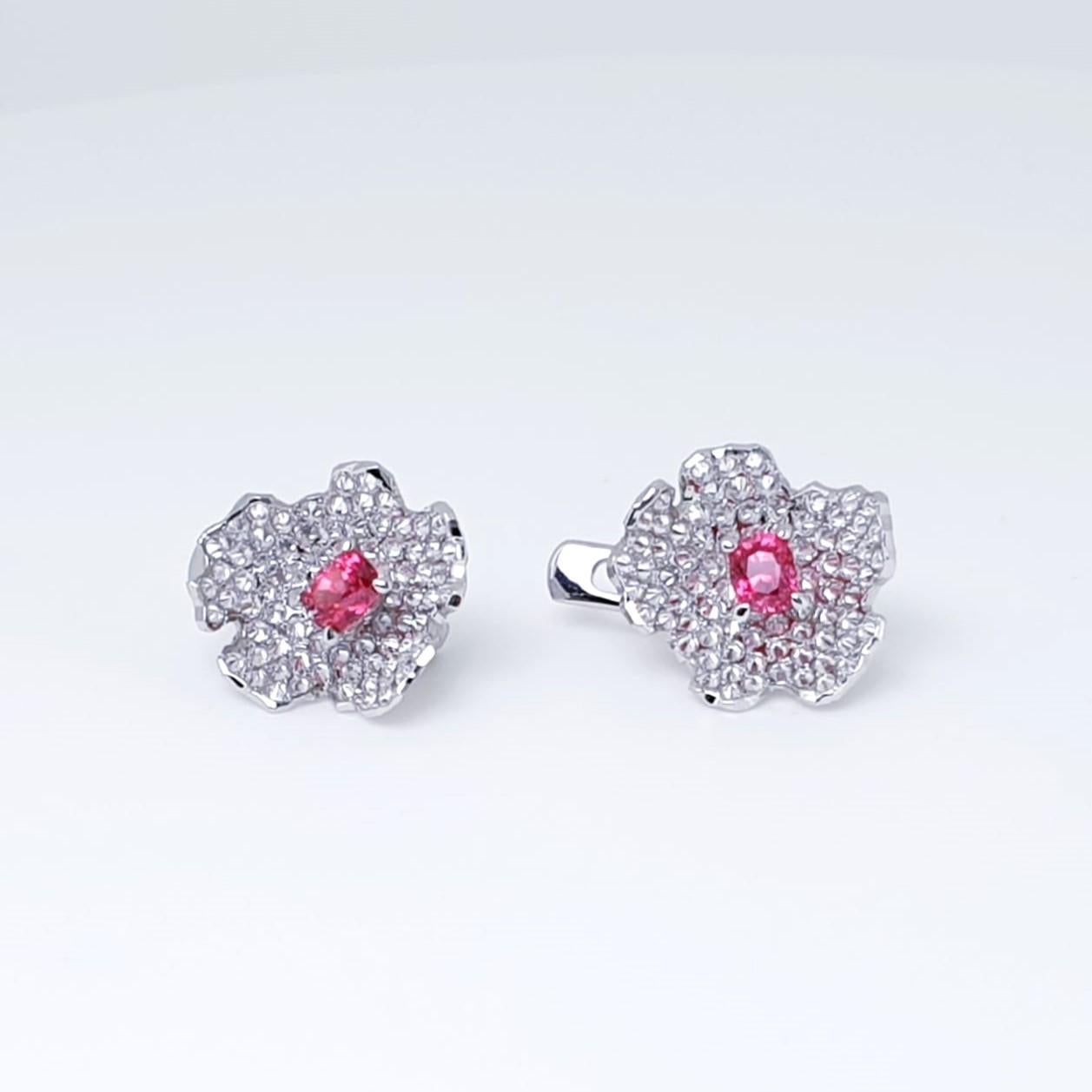 
In the shimmer of diamonds, a story unfolds,
Miracle of neon pink, a charm to adore.

MOISEIKIN's captivating Neon Pink Spinel Earrings are a tribute to this year's vibrant hues! The vibrant hue of rare pink spinels from Burma enhanced by reversed