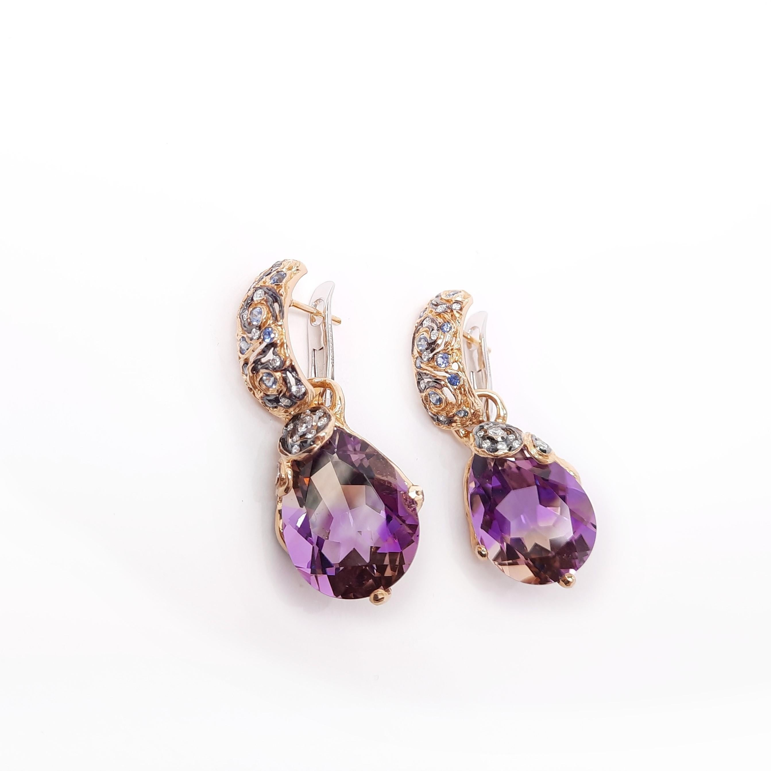 Inspired by impressionism and Starry Night by Vincent Van Gogh, MOISEIKIN® has created the swirling night sky image with intricate gold filigree, diamonds, sapphire and fancy ametrine illustrating mysterious night sky. The fashionable earrings have