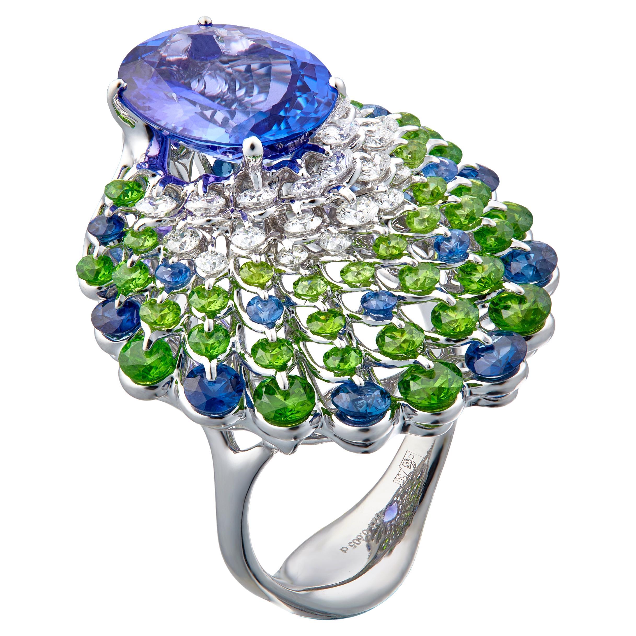 A vivid and clean 4.35ct Tanzanite is mounted in the innovative setting inspired by graceful peacock. Waltzing Brilliance technology is an innovative jewellery invention patented by Viktor Moiseikin, which a diamond facet gem is secured by two