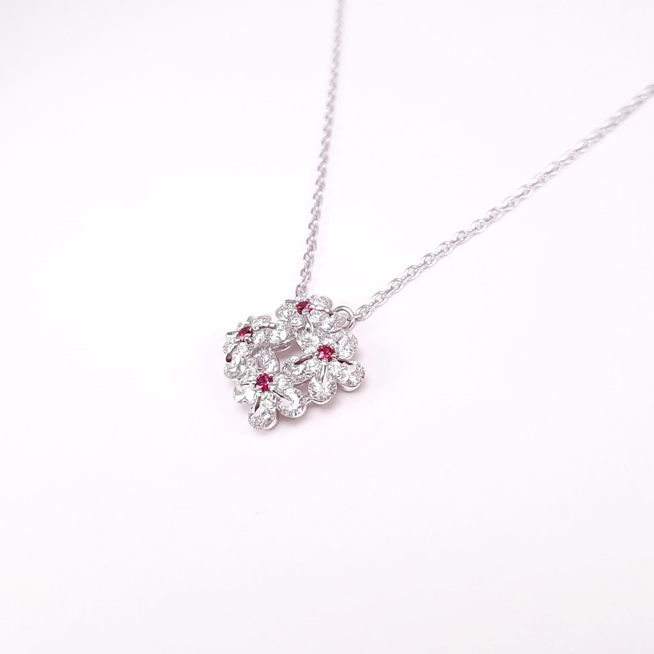Symbol of remembrance and eternal love, the Forget-Me-Not flower has become an everlasting flower. This innovative pendant necklace made in 18 karat white gold, over 1ct diamonds and vibrant rubies are mounted in MOISEIKIN's Waltzing Brilliance