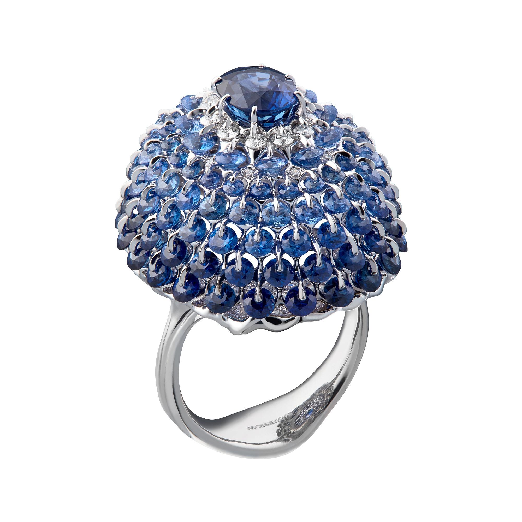 A deep blue No Heat Sapphire 1.95ct is mounted in a state of the art design and technology. 

Internationally patented, Waltzing Brilliance🄬 technology is an innovative jewellery invention of MOISEIKIN since 2013, in which a diamond facet gem