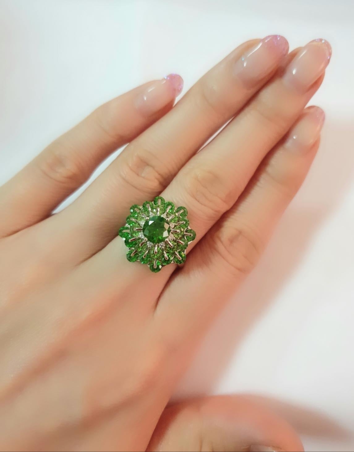 Russian Demantoid, the rarest and most valuable among all garnets, sparks the diamond-like brilliance. Its vivid colour and high spectrum of light and colours give vitality, new ideas, and opportunities and open up new ways of life. Such unique