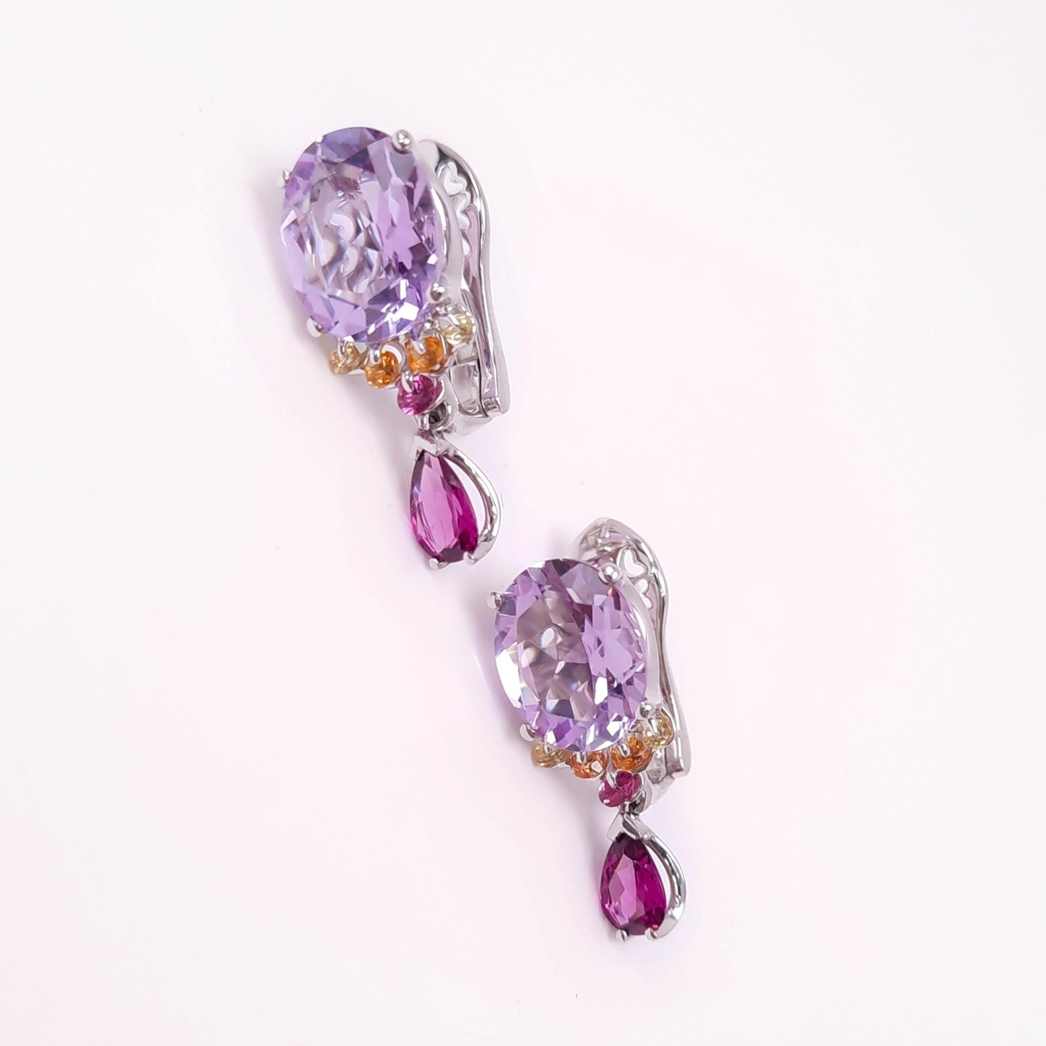 Crafted to perfection, MOISEIKIN's colourful earrings  from the Tsvetodelika collection are made with mysterious and graceful amethyst, diamond-cut golden sapphires, and feminine rhodolite garnets. Using the patented technology that would bring more