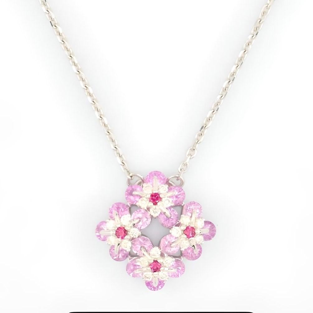 Symbol of remembrance and eternal love, Forget-Me-Not flower has become an everlasting flower. Made in 18karat white gold, diamonds, rubies, and vivid pink sapphires are uniquely set using the Waltzing Brilliance technology. This lively neckalce