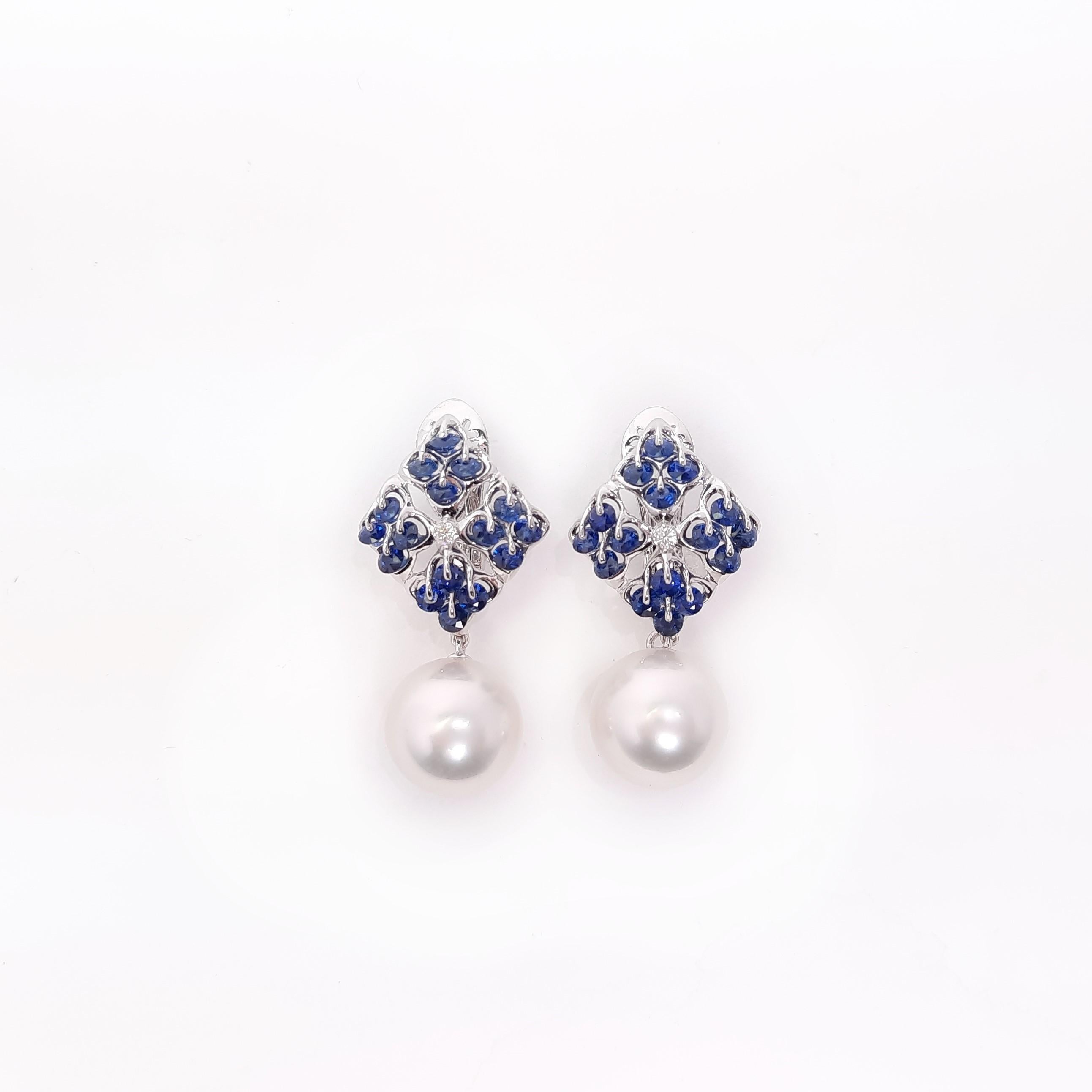 A pair of the top quality 11mm round South Sea Pearl is elegantly designed in our star shape sapphire earrings, mounted in a unique gem stone setting, Waltzing Brilliance. A spectacular dance performance of diamond cut blue sapphires on the