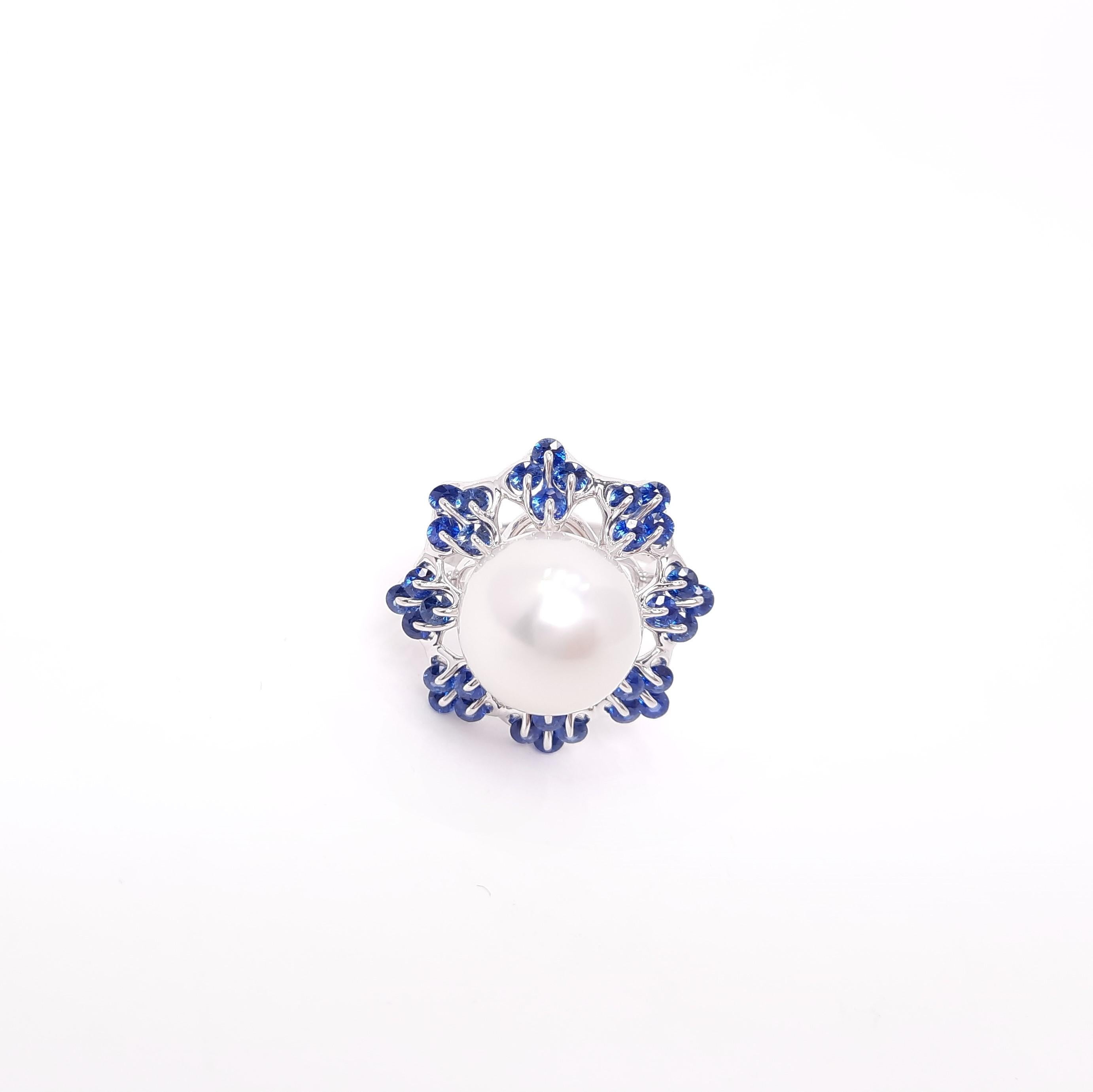 The top quality 11-12mm round South Sea Pearl is elegantly mounted in our unique jewellery setting, Waltzing Brilliance. On the ballet tutus -like design frame, radiant blue sapphires swirl 360 degrees on the setting just like graceful ballerinas.