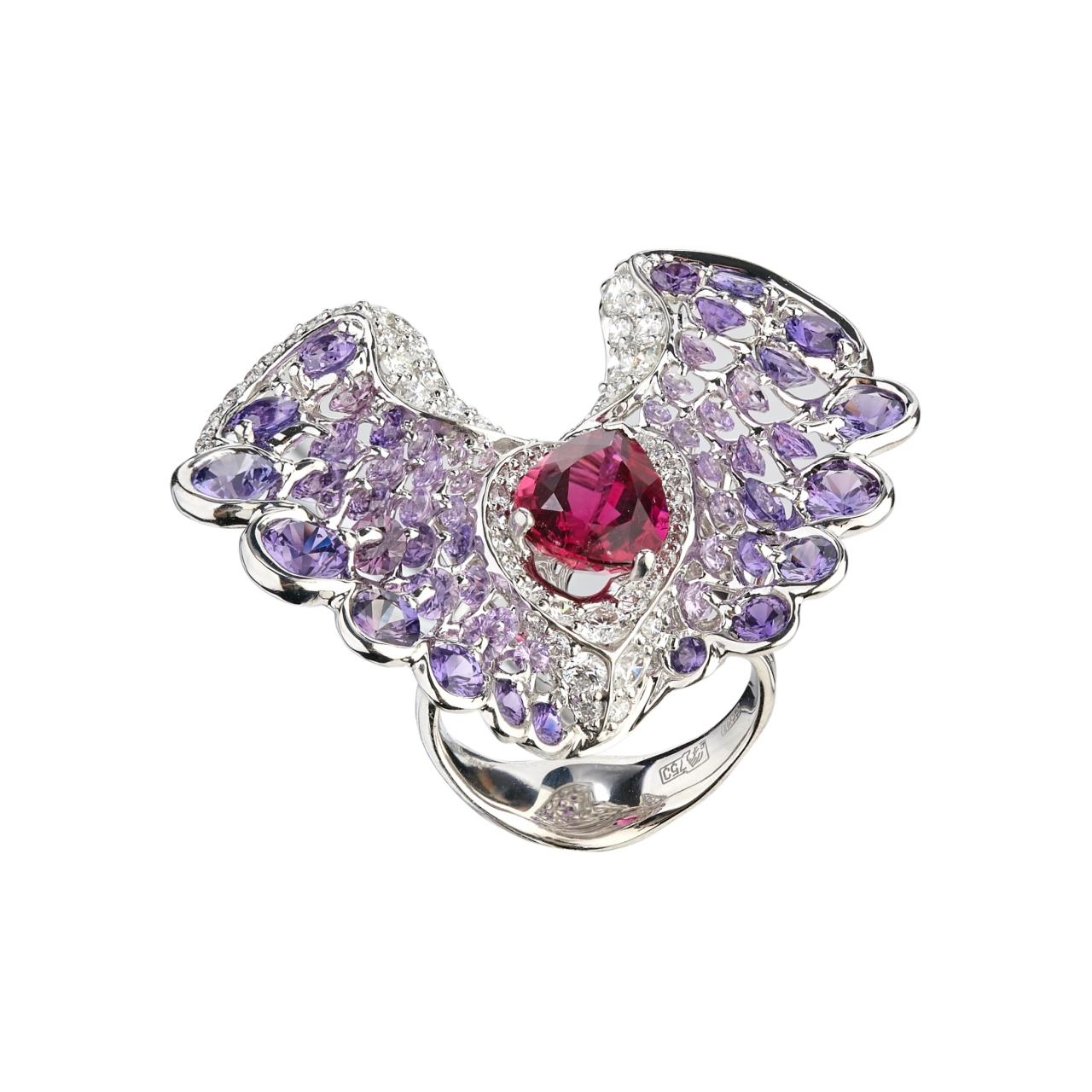 A tridimensional butterfly fashion ring captivates the full attention with its unique design and the perfect feminine colour shades. 
The ring is made of 18 Karat white gold and the unique colour gradation of diamond cut violet sapphires secured by