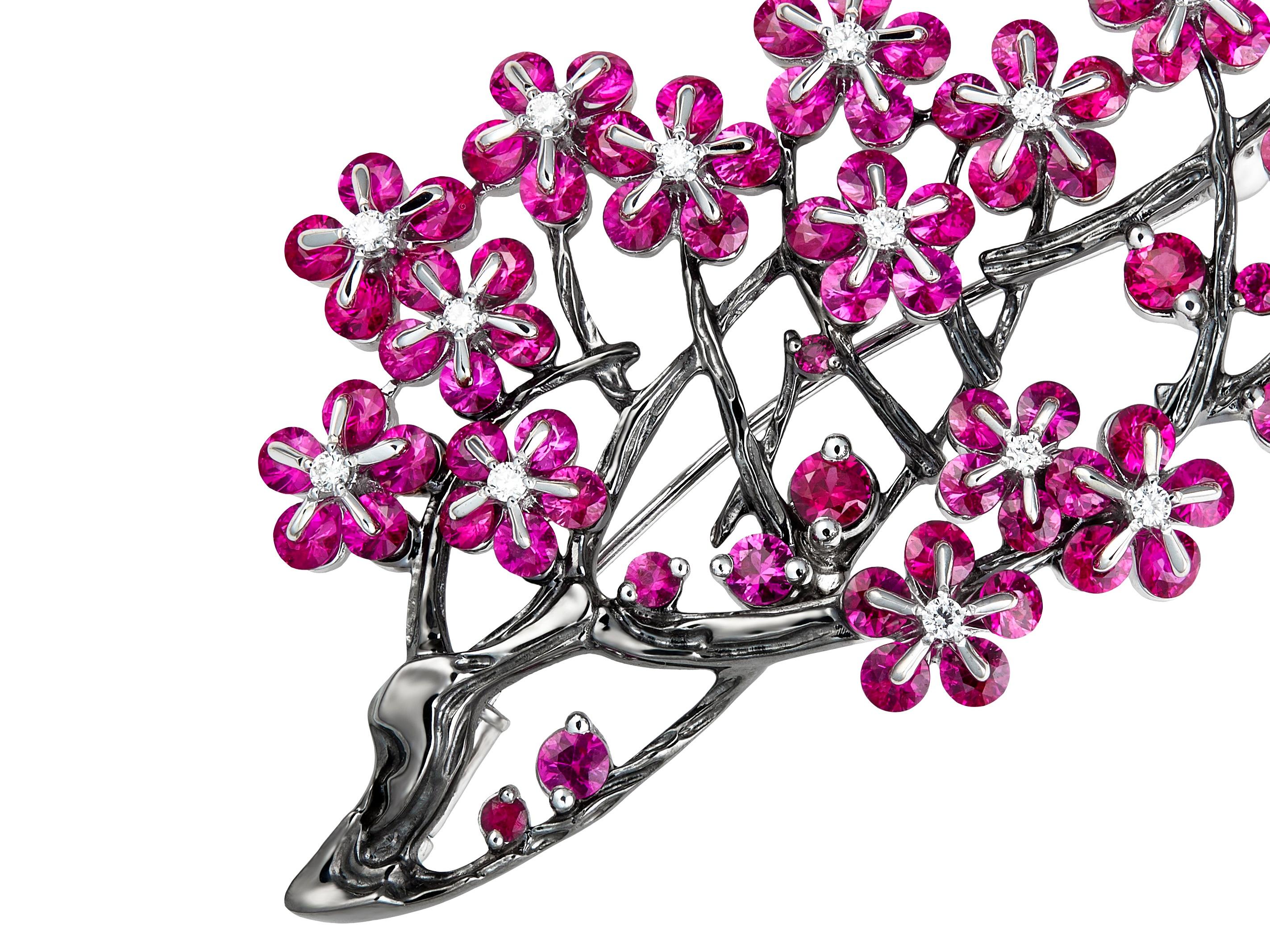 MOISEIKIN created a glamorous ruby and diamond brooch employing the patented technology that enables gems to dance and tremble. Inspired by the passionate ripe plum tree and spiritual calligraphy, the brooch is made with over 9ct top-quality rubies