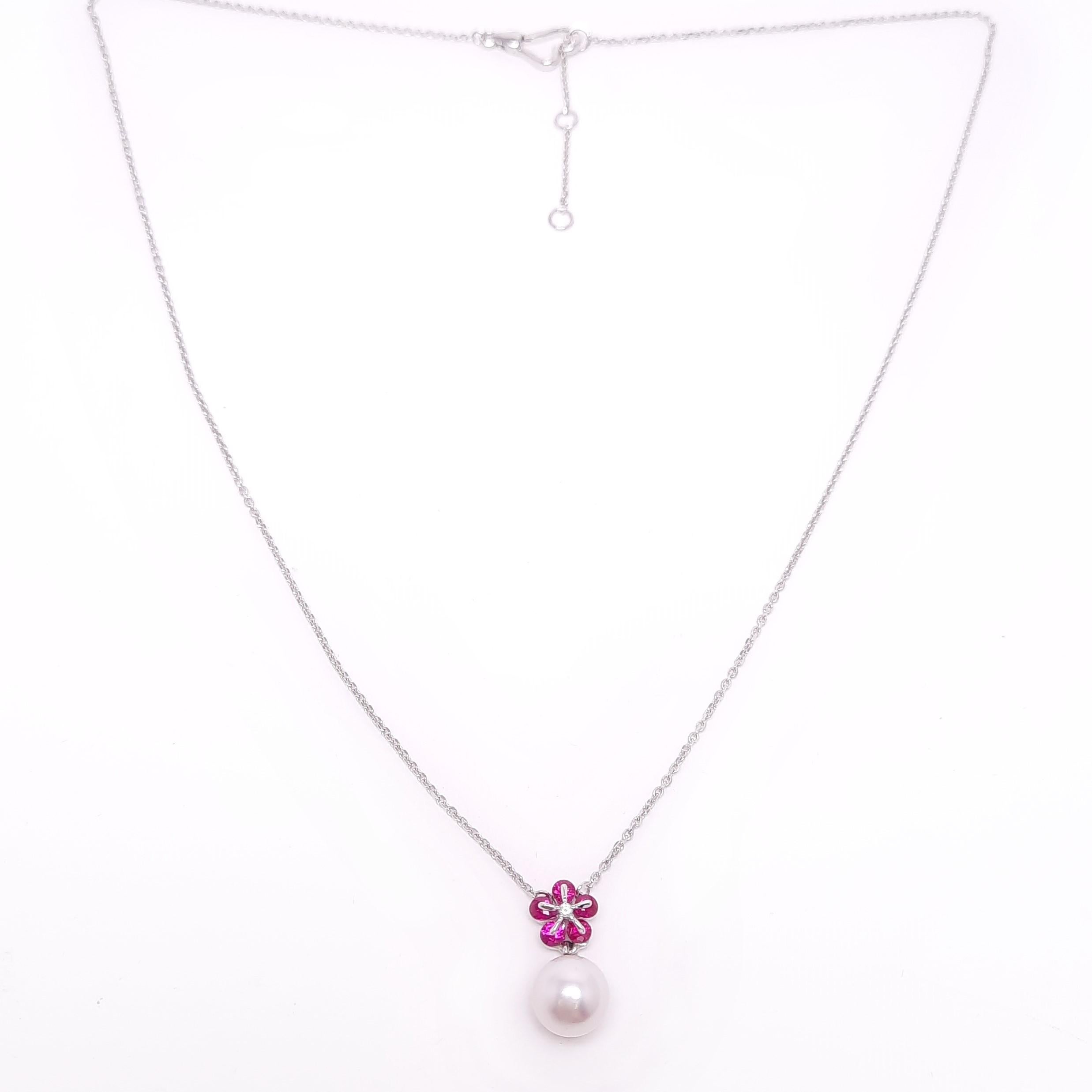 Pearls jewellery always suit any occasion.
This necklace is made of 18K white gold, pinkish 7-7.5mm Akoya pearl (AA grade+) from Japan, and diamond cut rubies mounted in the modern Russian setting 