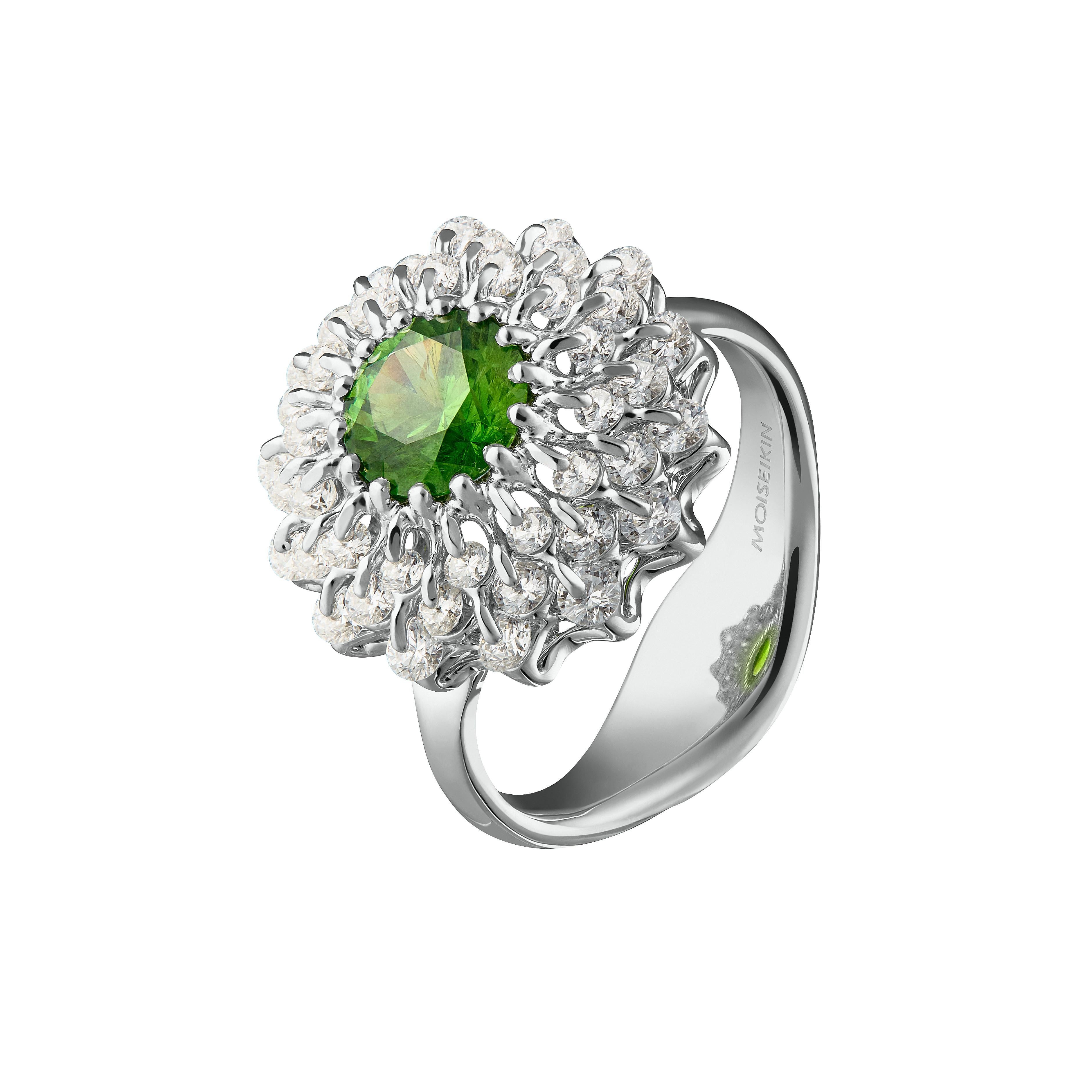 1.38ct Russian Demantoid Garnet is mounted in the innovative diamond jewellery design inspired by famous ballet. 

Internationally patented, Waltzing Brilliance technology is an innovative jewellery invention patented by a leading Russian designer,
