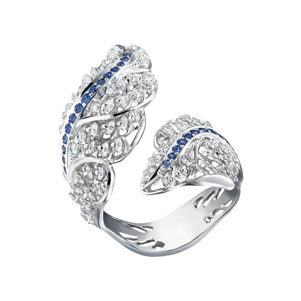 A fashionable yet graceful angel wing ring created by Viktor Moiseikin is  embedded with high quaity diamonds and a sapphire belt gives a little accent. 

The stones are mounted in the innovative jewellery setting 