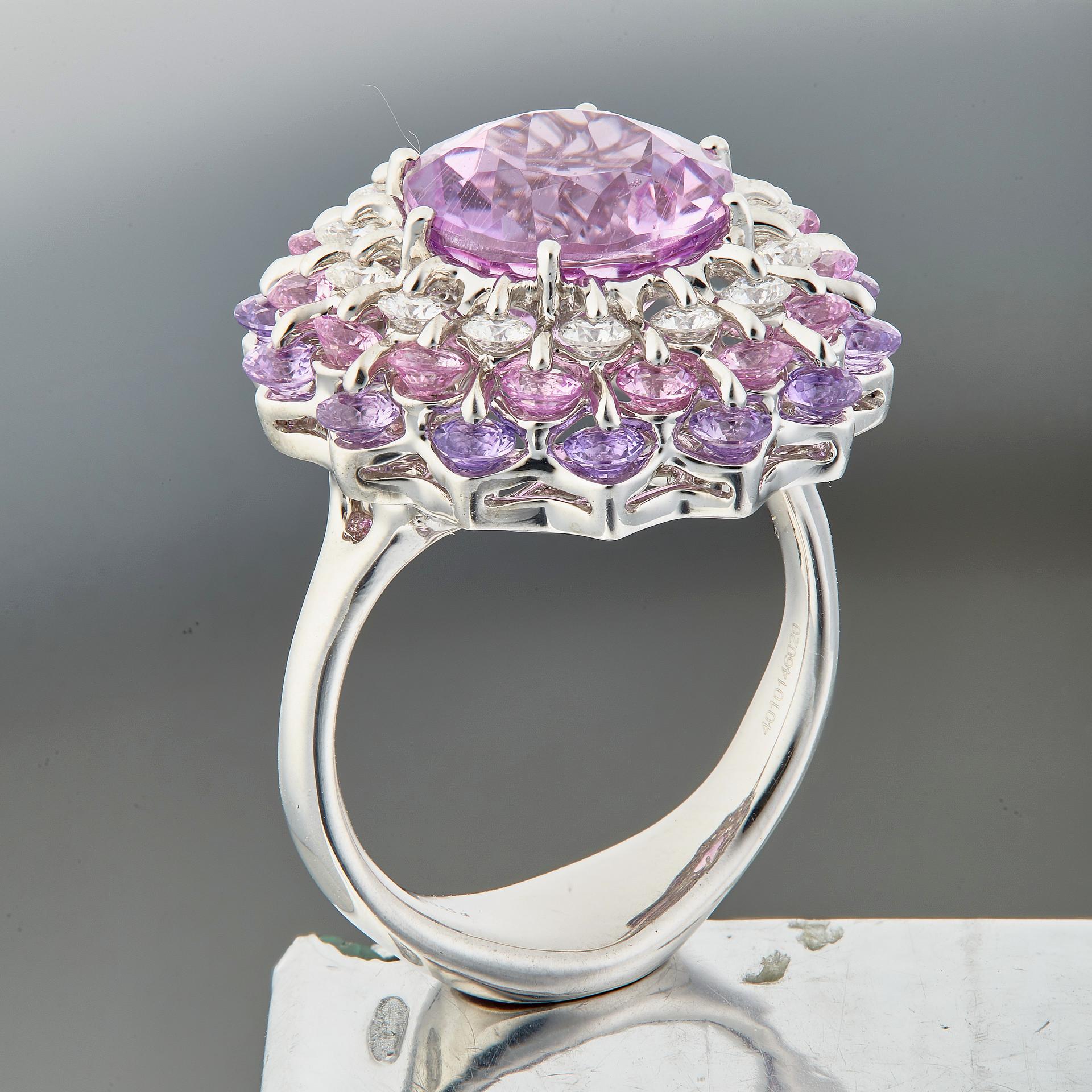 Deep pink facet Kunzite is mounted in state of the art design and technology. Internationally patented, Waltzing Brilliance technology is an innovative jewellery invention patented by Viktor Moiseikin, which a diamond facet gem is secured by two