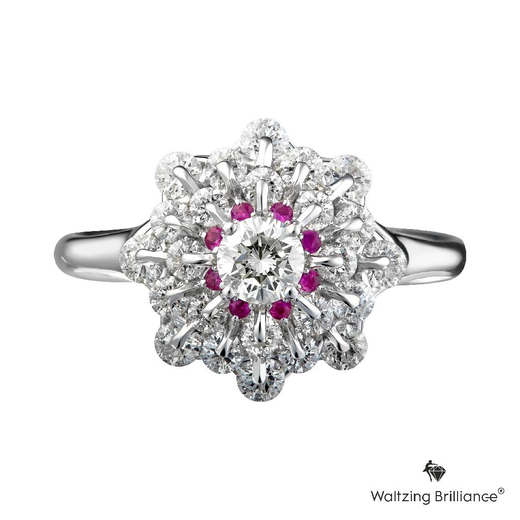 A diamond ring made in a modern classic style gives a fresh and tender look. The beauty of the central stone is elevated by the surrounding diamonds mounted with Waltzing Brilliance®　technology, in which stones rotate freely at 2 points. Because of