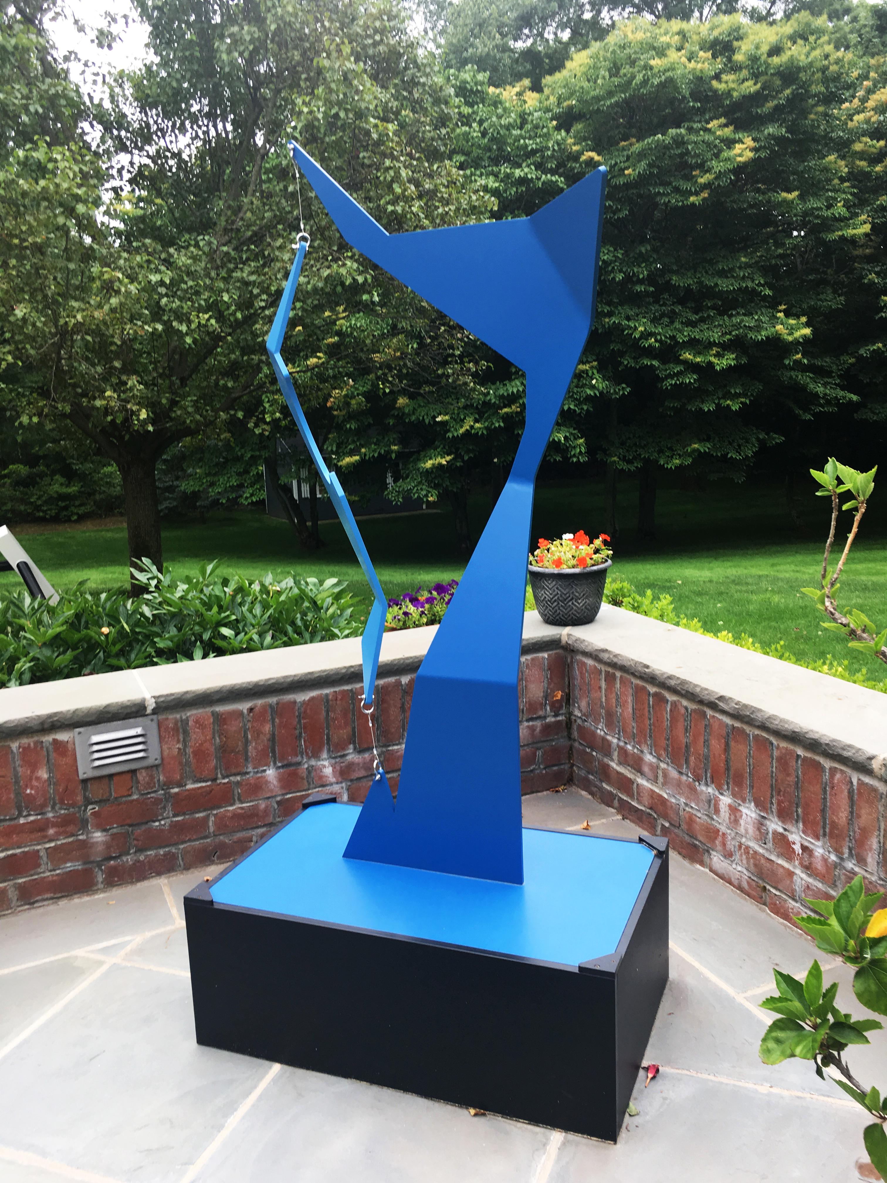 "Blue Mast" is a kinetic sculpture by artist Moises Morgenstern.  The sculpture can be installed indoors or outdoors.  Measurements are 63" H x 34" W x 20" D.  The sculpture is made of aluminum with stainless steel hardware and painted with