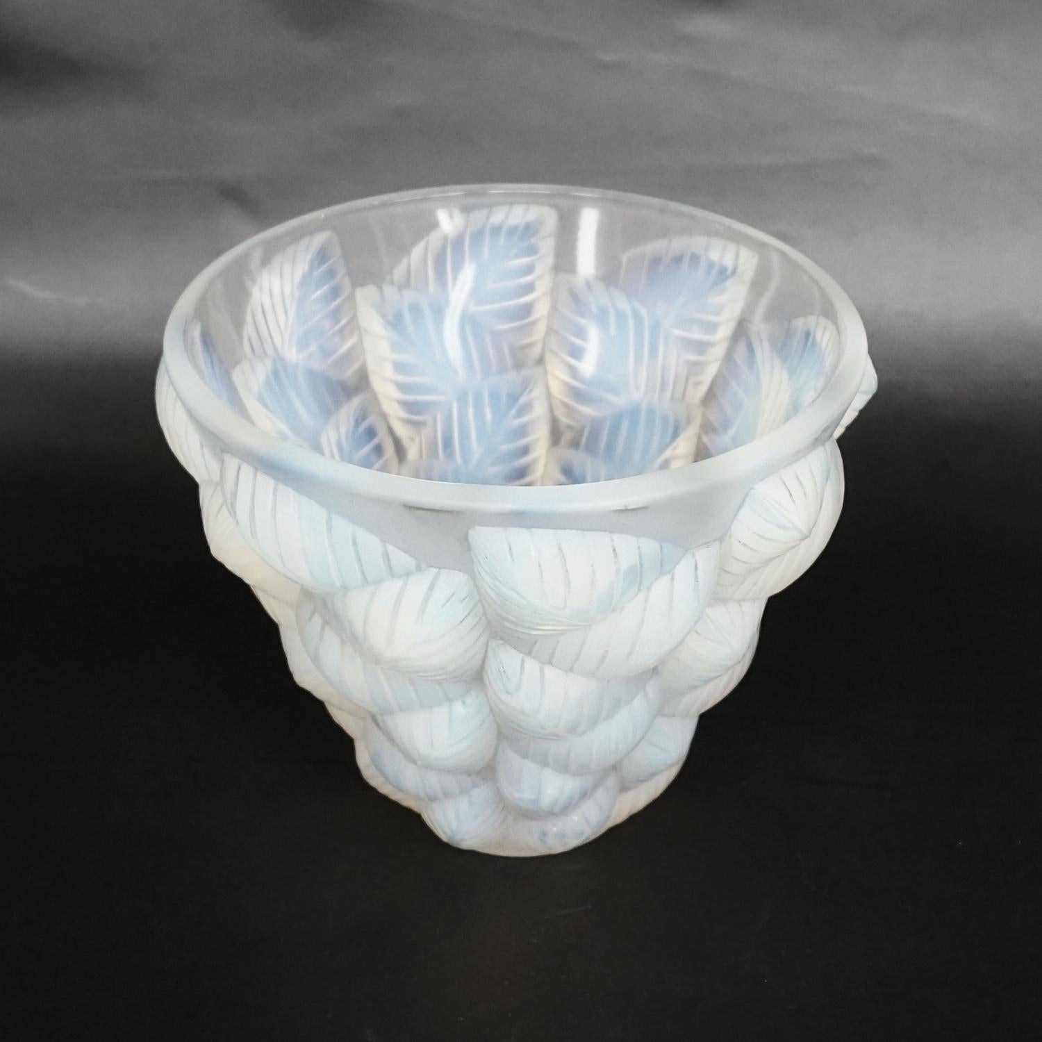 Moissac, an Art Deco glass vase by Rene Lalique (1860-1945). Opalescent glass with blue highlighting, decorated over with a relief moulded, geometric leaf design. Model no. 922 . Literature: Marcilhac, R Lalique Catalogue Raisonné de L’Œuvre de