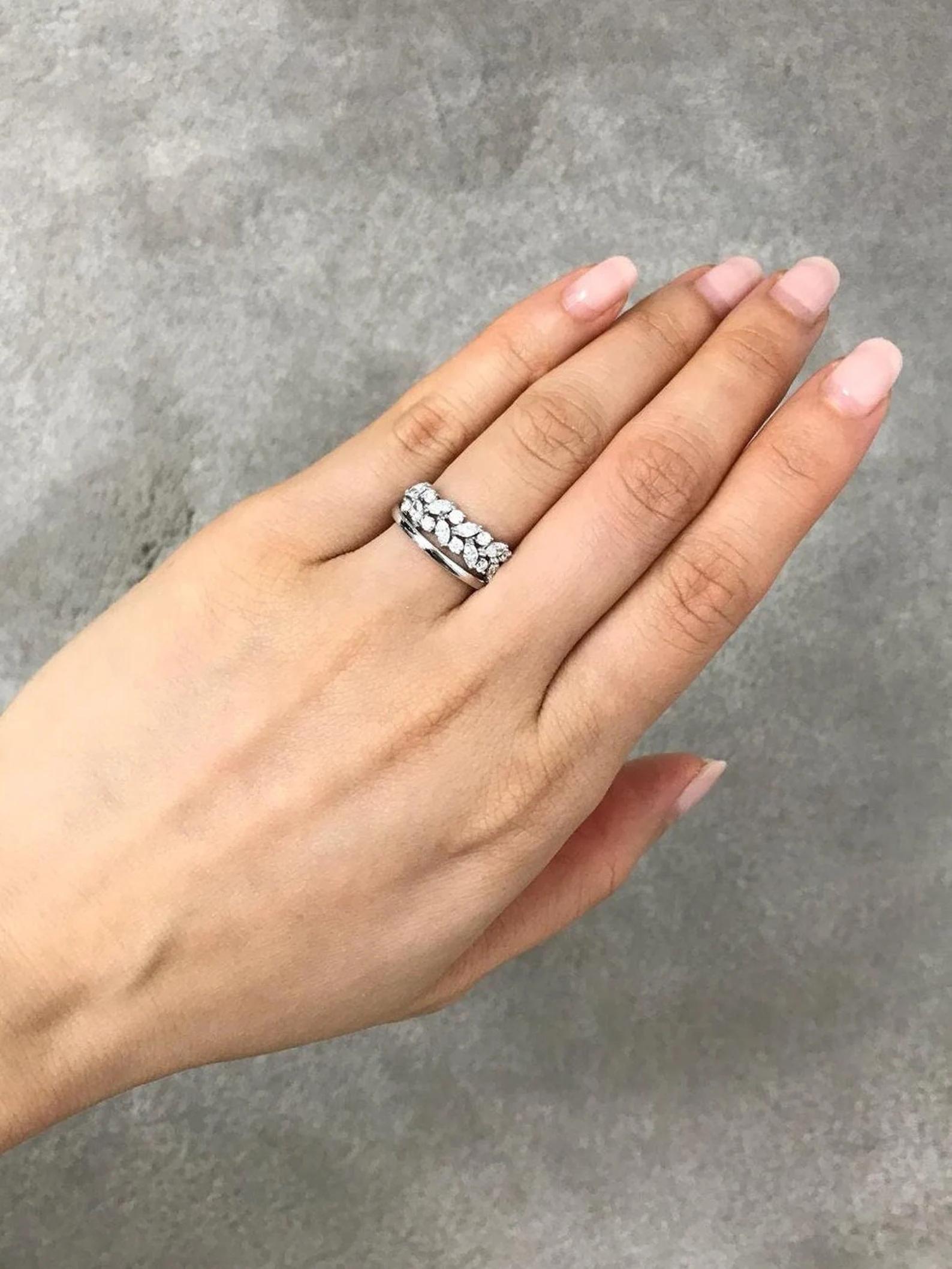 Alternating round and marquise diamond create an alluring pattern across the top of this elegant and distinctive ring.

8 Round Moissanite: Carat total weight 0.24ct
8 Marquise Moissanite: Carat total weight 0.48ct
Diamond quality: D-F color, VS+