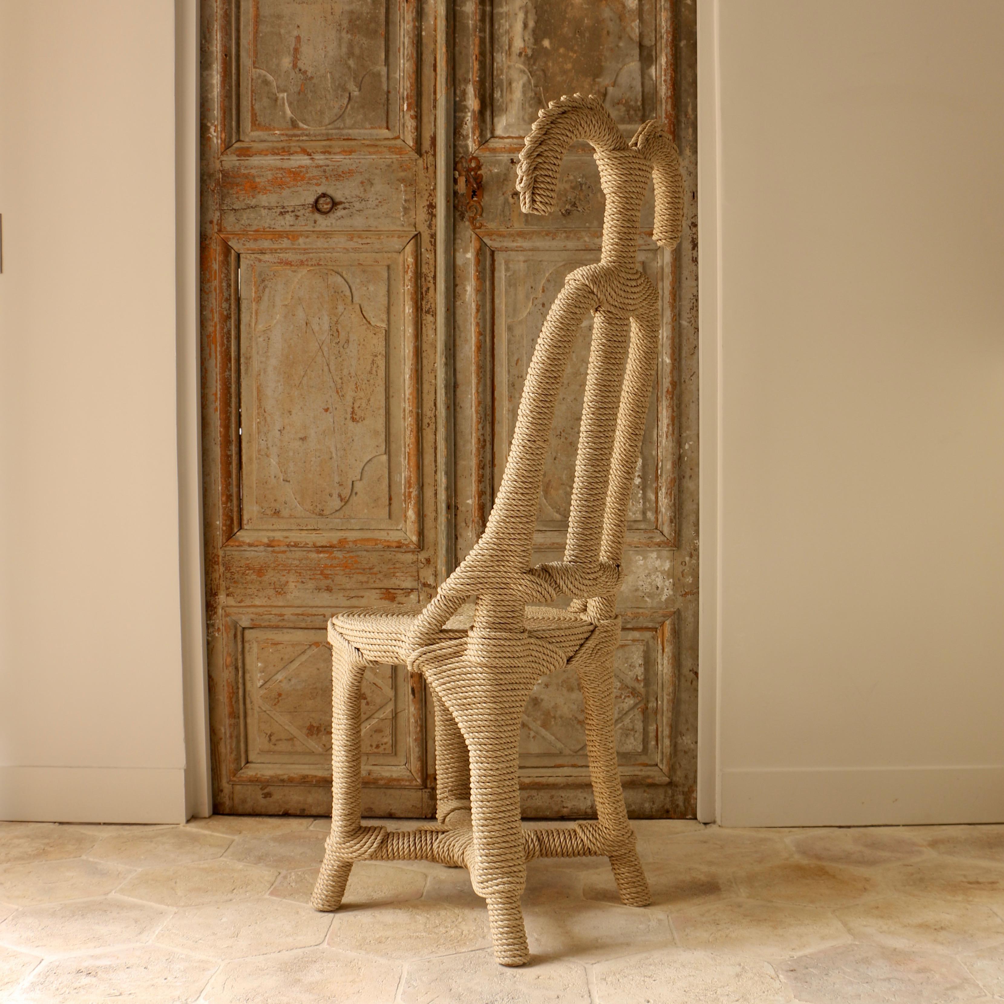 Moiste chair designed by Christian Astuguevieille in rope tied over a structure in wood.