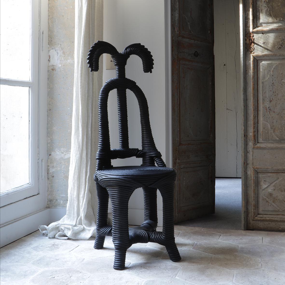 This chair is made of cotton rope painted in black and has a chestnut wood frame. It is part of the Moisson collection.

Christian Astuguevieille is a versatile artist, designer and creator. He often uses raw organic materials such as wood