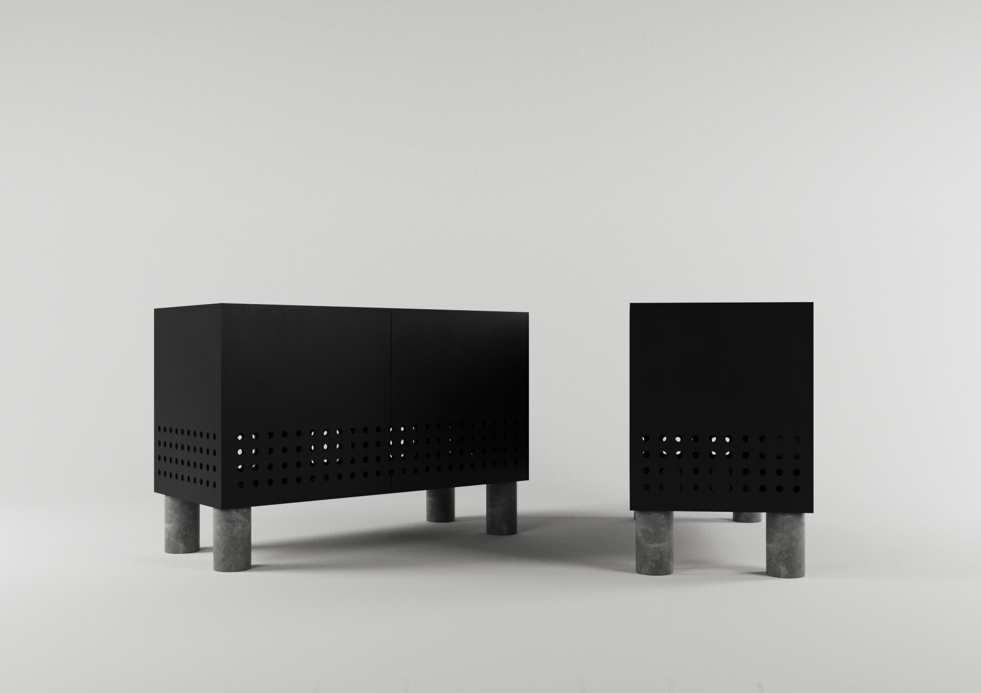 The simple shape of the object finished in black color, does not prevent it from becoming a mysterious black box owing to the perforation of its panels and playful legs. Laconic and refined proportionality impart exquisiteness to the simple form and