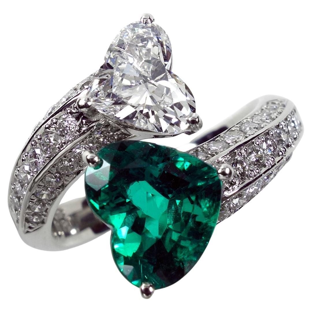 the Epitome of Love: Platinum Heart-Shaped Emerald and Diamond Ring!

Indulge in the beauty of everlasting love with our Platinum Ring, featuring a stunning 1.70ct Heart-Shaped Emerald and a 1.011ct Heart-Shaped Diamond. This exquisite piece is