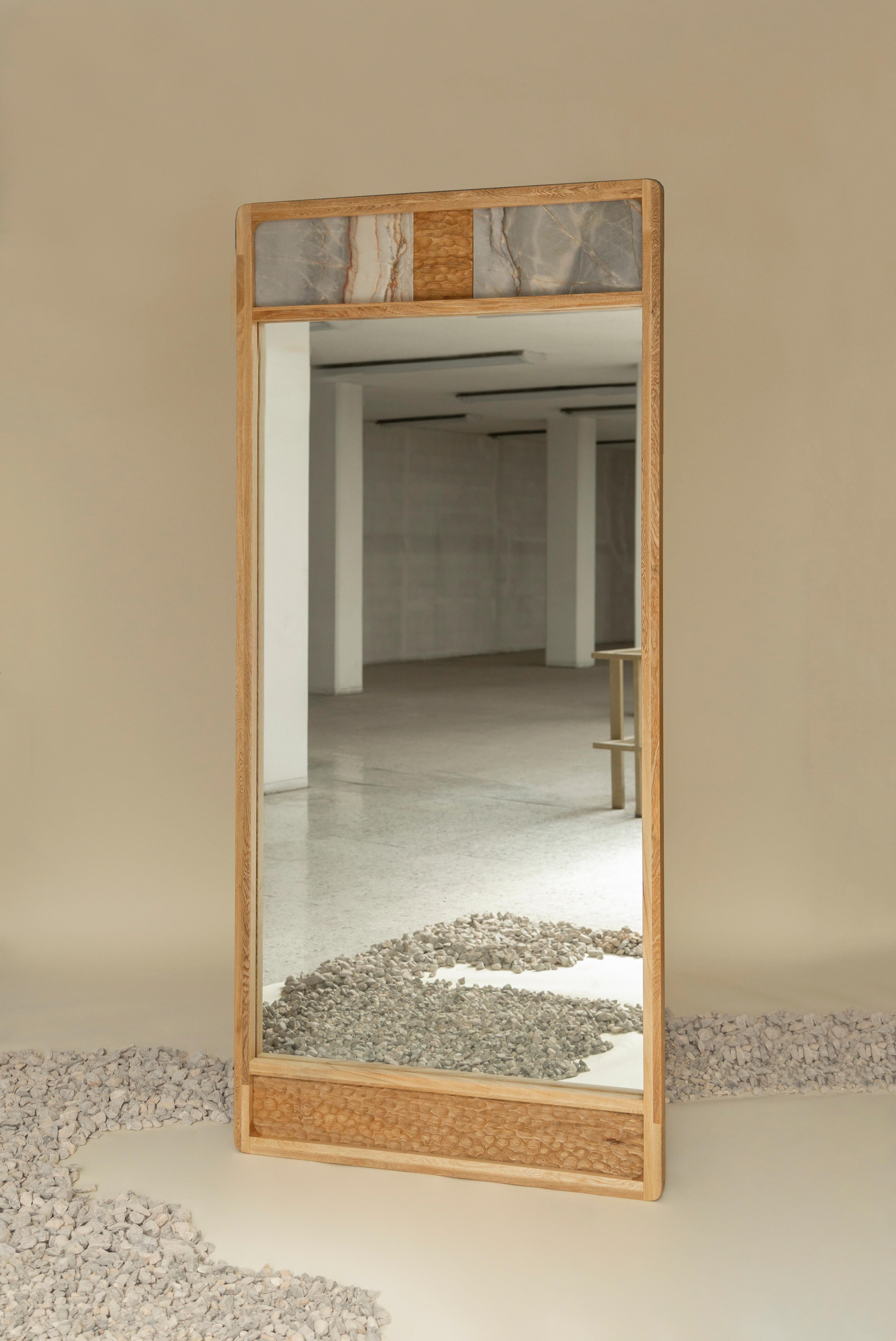 The Mojave floor mirror is made with Mexican Rosa Morada wood. It's hand crafted with great attention to detail. The mix of marble, wood and texture makes for an unforgettable piece. The design goes well with different style rooms.