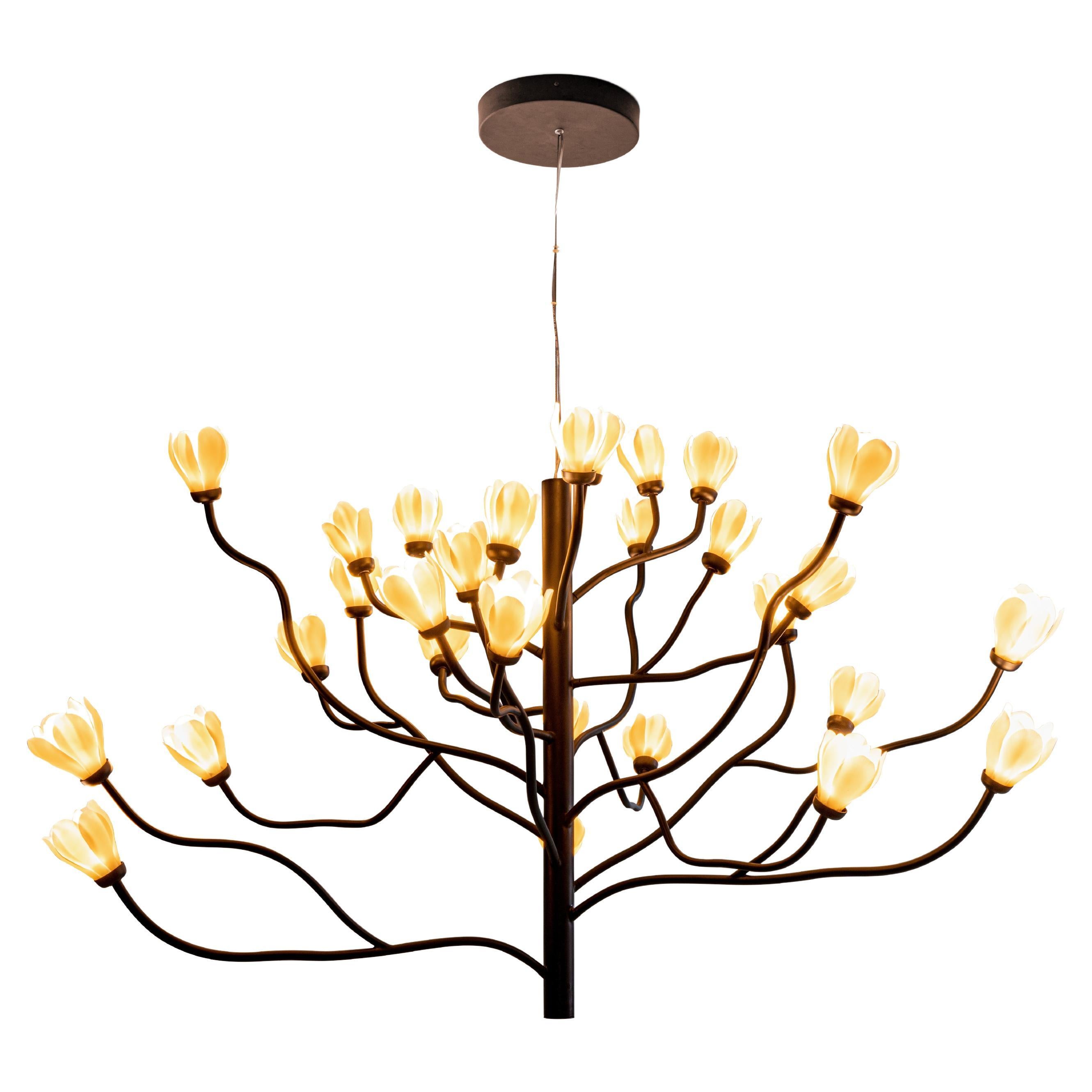 Aluminum metal and matte porcelain chandelier inspired by the white magnolia tree. MOKUREN / LIGHTING WITH SOUL - Mokuren is the result of the first collaboration between Lladró and Japanese designer Naoto Fukasawa, who is known for combining