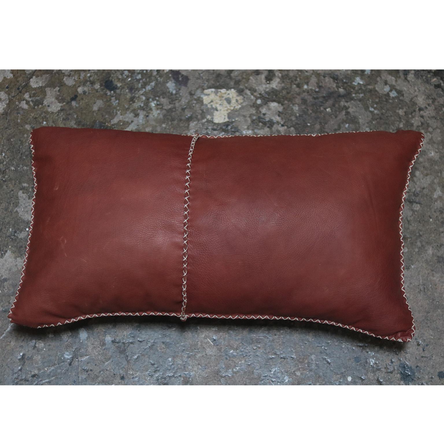 The Molana pillow combines vintage African textiles and Italian leather with a hand stitched waxed cotton seam.  We use high quality pillow inserts for comfort.  

These pillows express handmade, imperfect qualities that are sure to add interest to