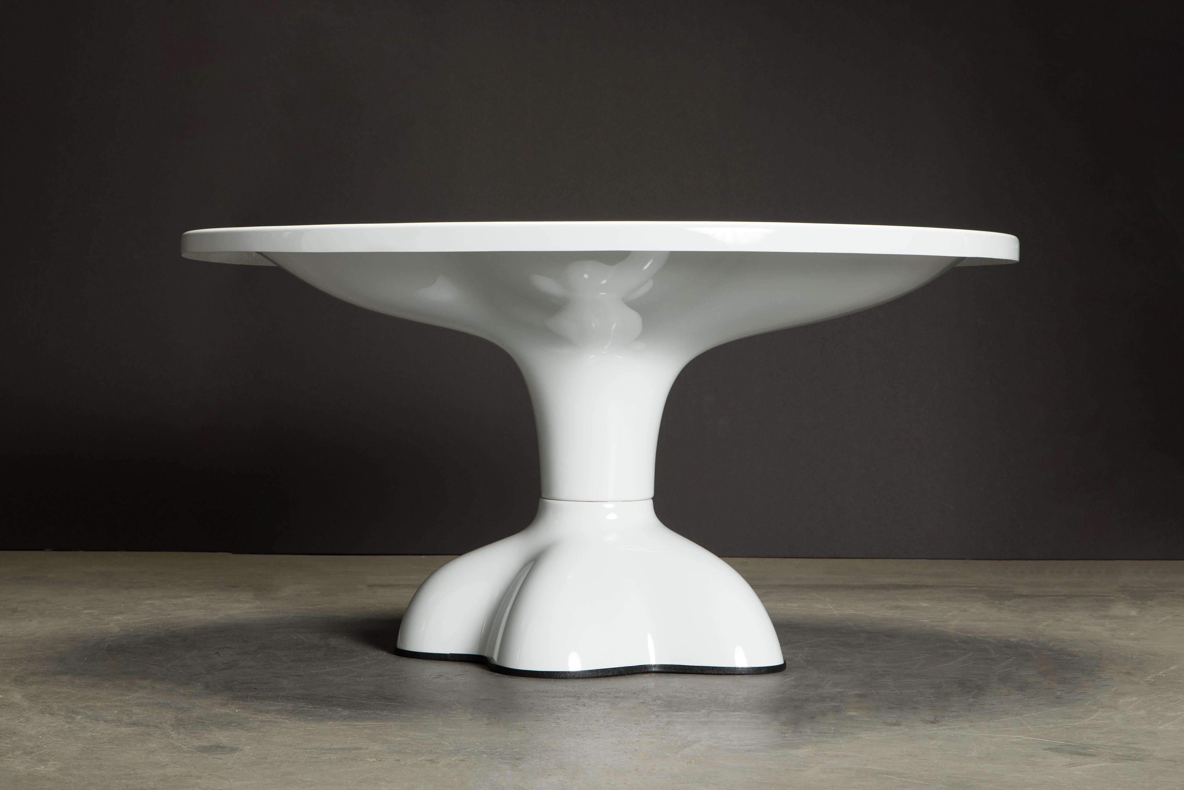 This rare early production collectors piece is a circa 1969 'Molar' dining table by Wendell Castle (American, 1932-2018) made from gel-coated white fiberglass with black rubber footing. The top is a fantastic oval shape (56