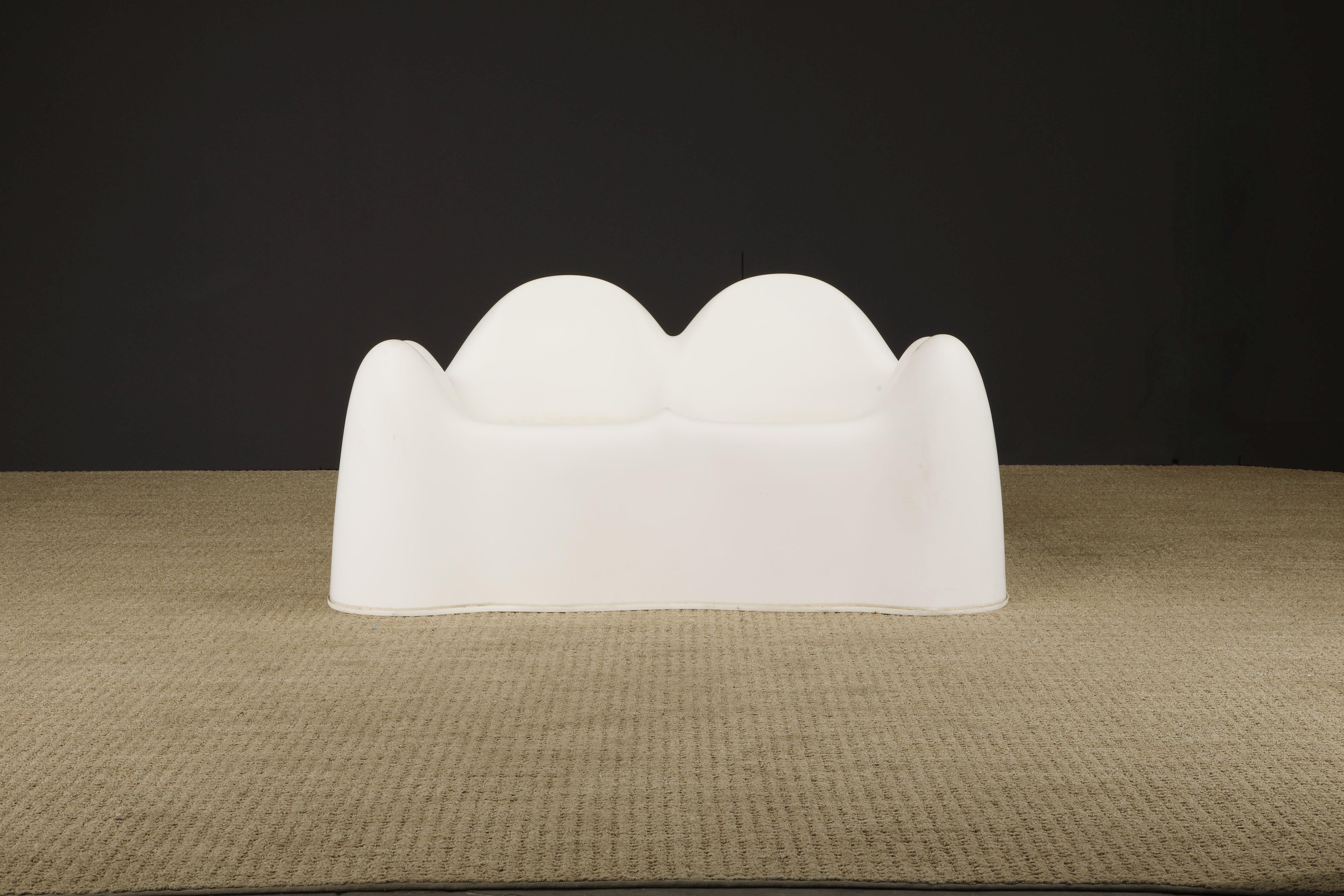 This rare early production collectors piece is a circa 1969 'Molar' settee by Wendell Castle (American, 1932-2018) made from gel-coated white fiberglass with molded white rubber footing. 

As Wendell Castle continued production on the Molar group of