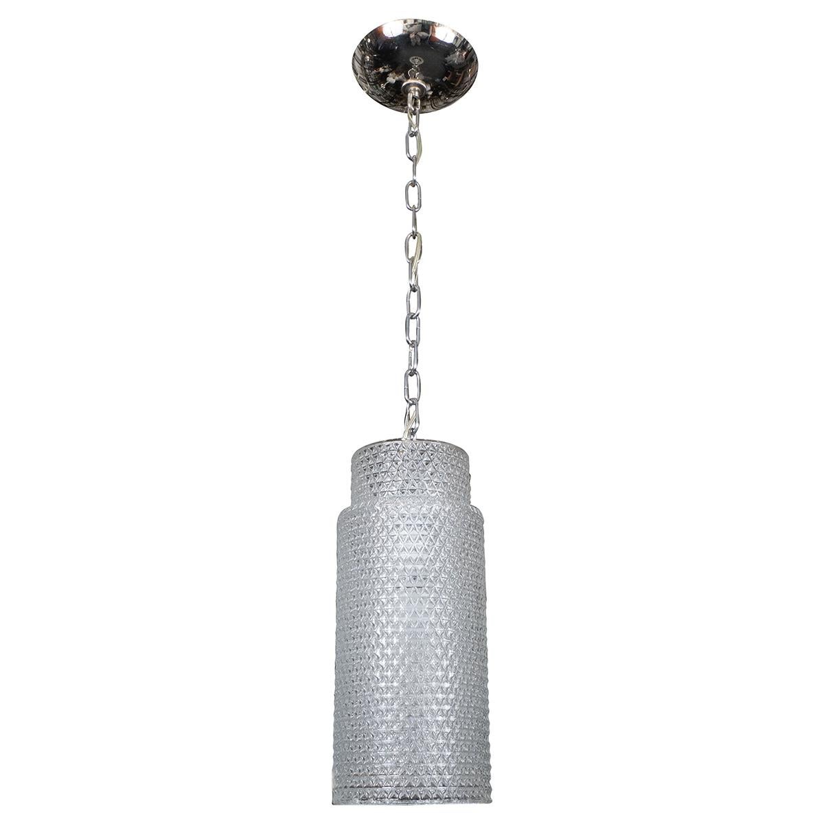Molded glass cylindrical pendant with nickel hardware.