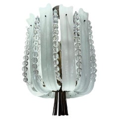 Apparecchio di illuminazione in vetro stampato e cristallo