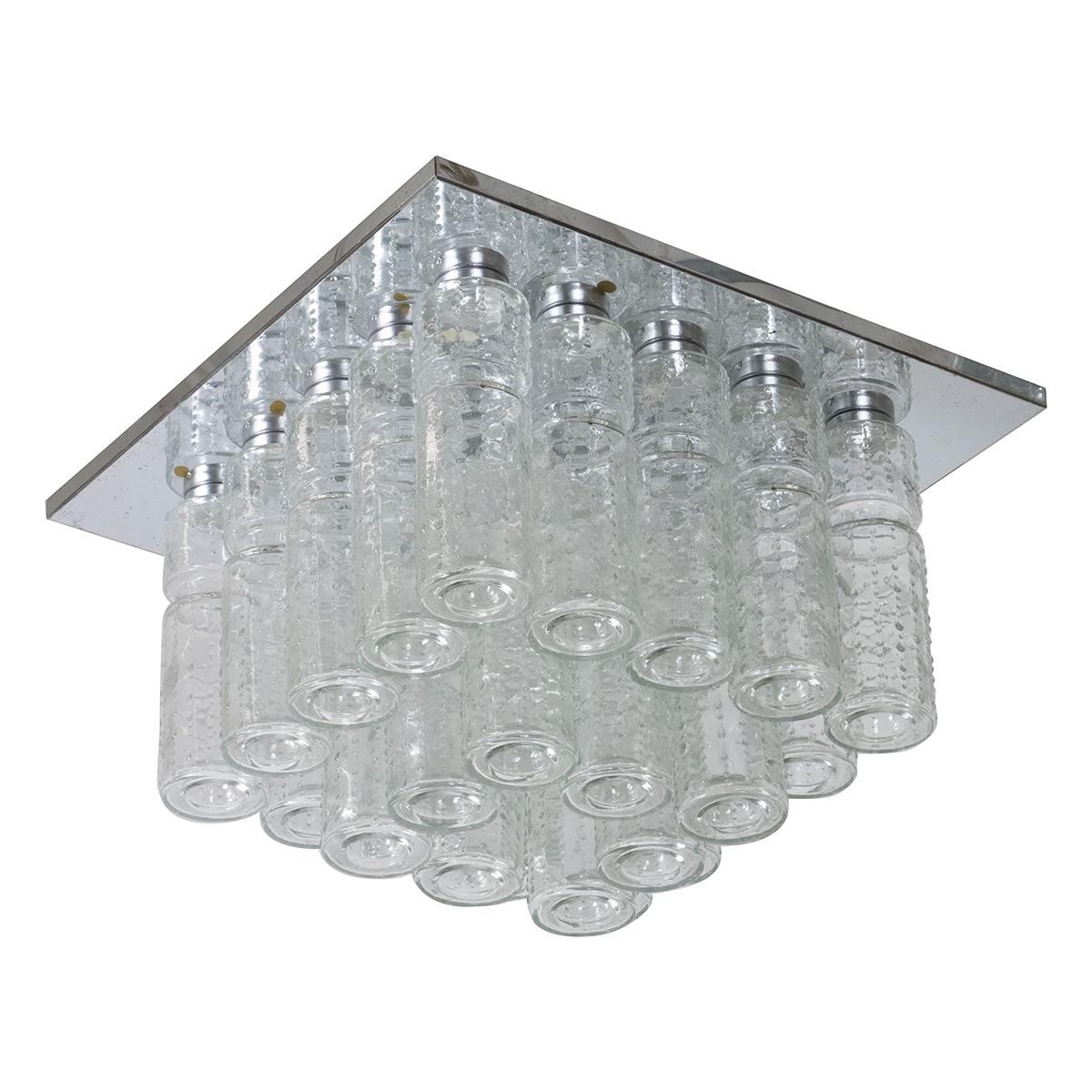 Flush mount fixture composed of multiple molded glass cylindrical elements with nickel frame by Doria.