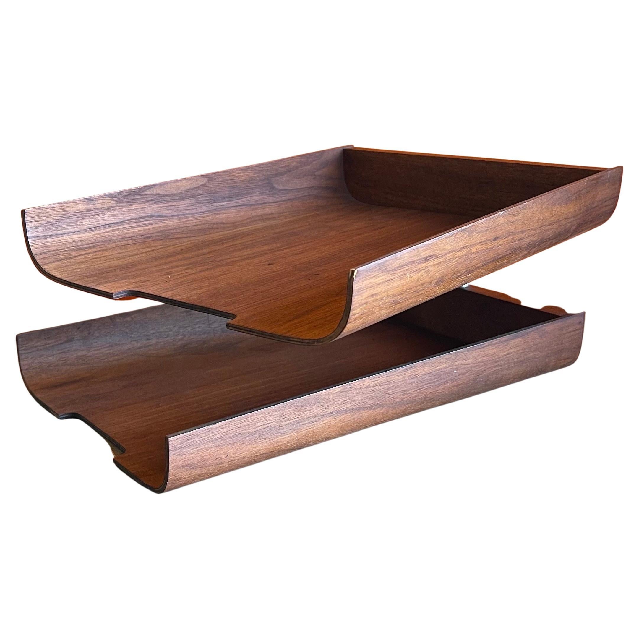 Very nice and functional double letter tray in the style of Martin Aberg for Rainbow Wood Products Company of Sweden, circa 1970s. The trays are made of molded teak plywood and can swivel into any number of configurations to meet your office needs.