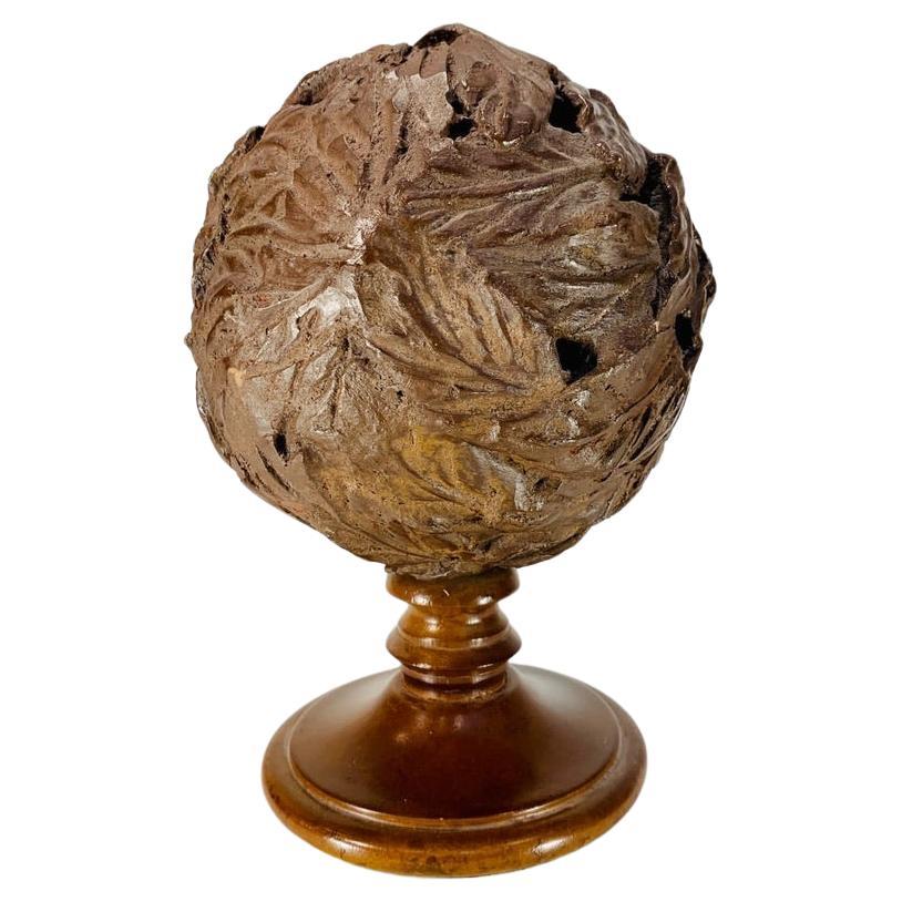 Molded terracota pine cone Art Deco on wooden base with leaf motif circa 1930 For Sale