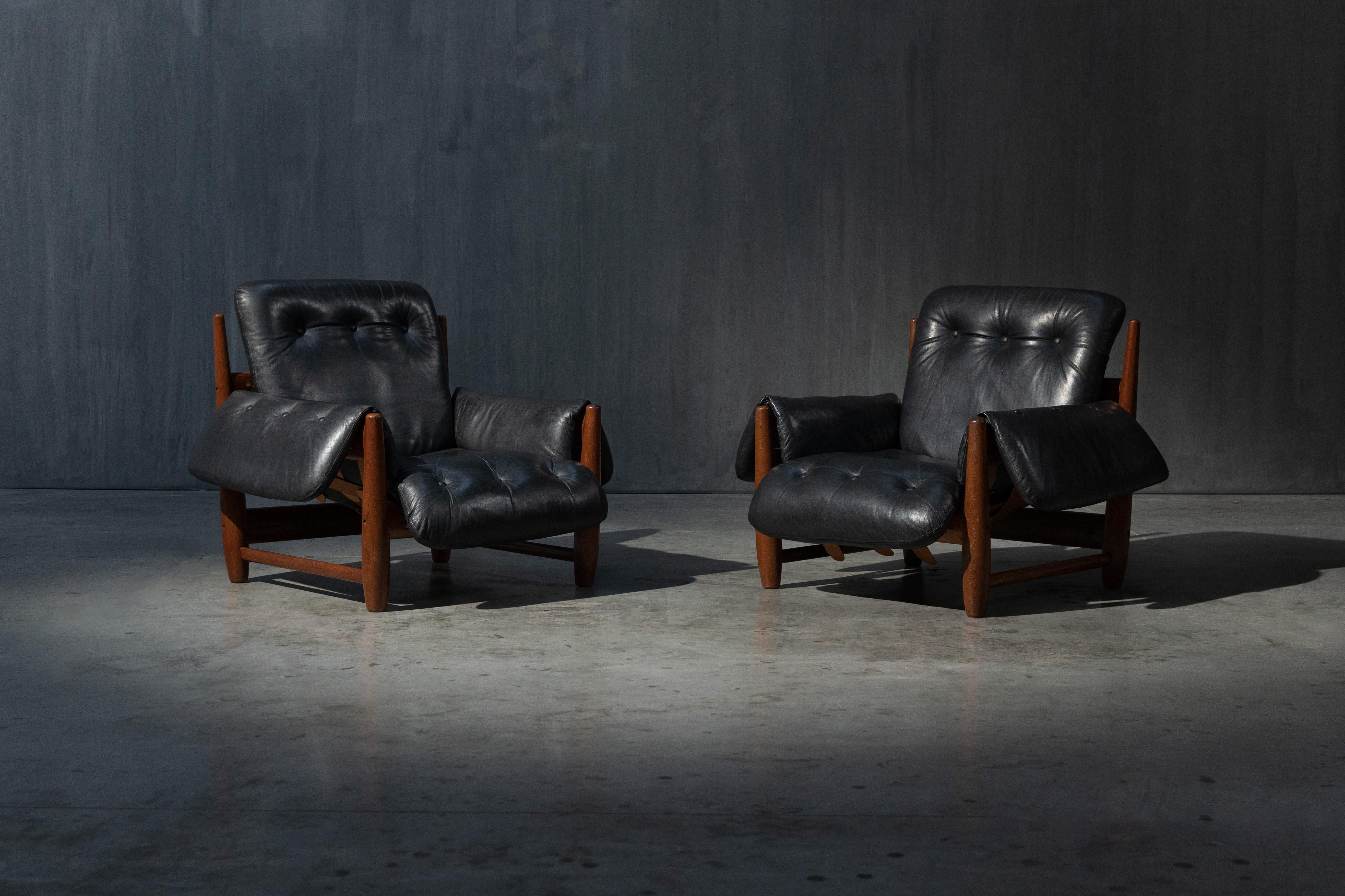 Designed by Sergio Rodrigues in 1957, these iconic Mole lounge chairs embody the essence of Brazilian mid-century modernism. Featuring solid rounded jacaranda wood frames, adjustable leather support straps, and oversized, floppy leather cushions,