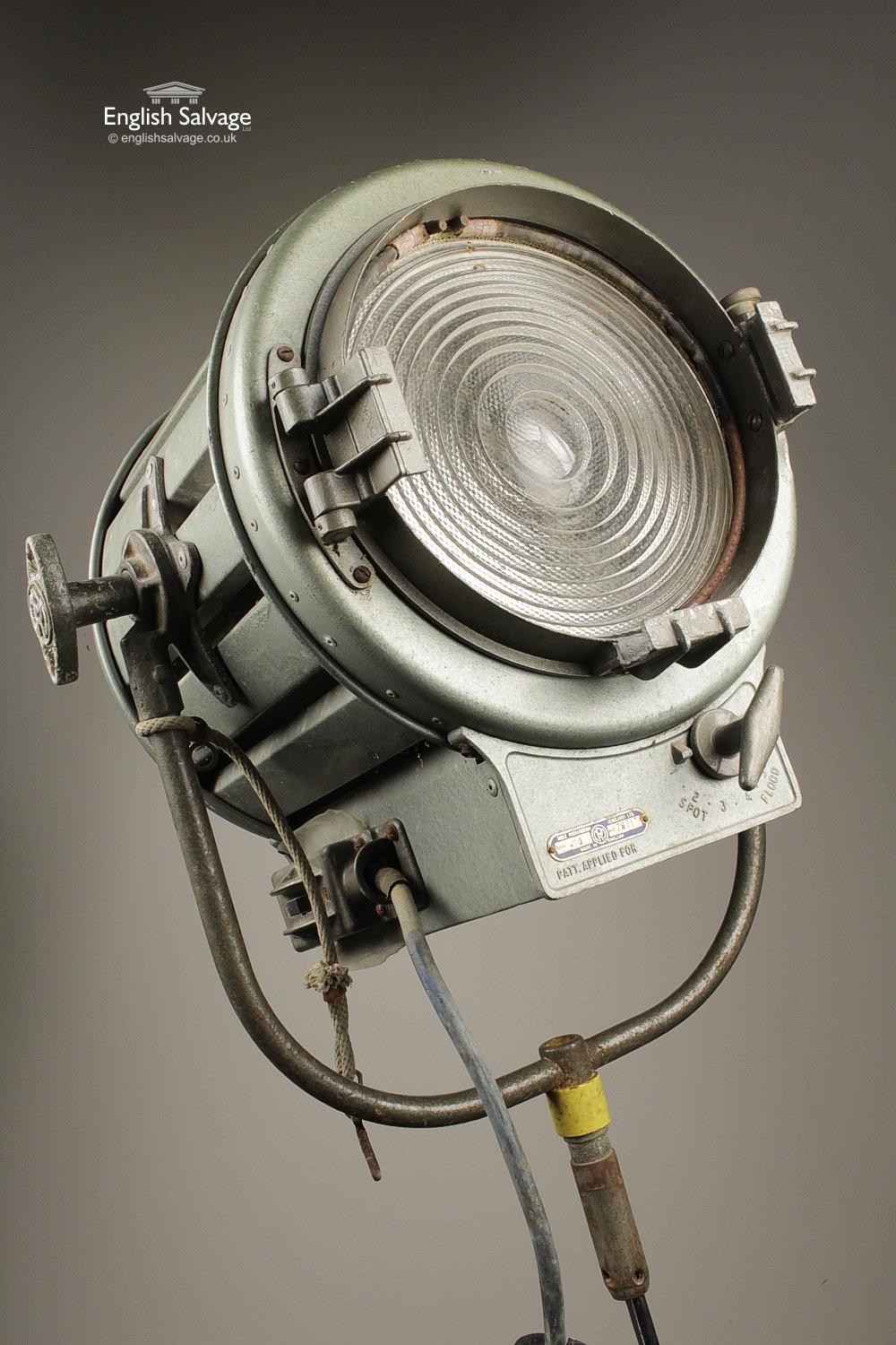 Industrial 1930's Mole Richardson lights with hanging handle/stand mount. Features hinged front door with fresnel lens and a spot and flood light adjusting knob. Stand shown is not included, dimensions listed include the handle. Old wiring present