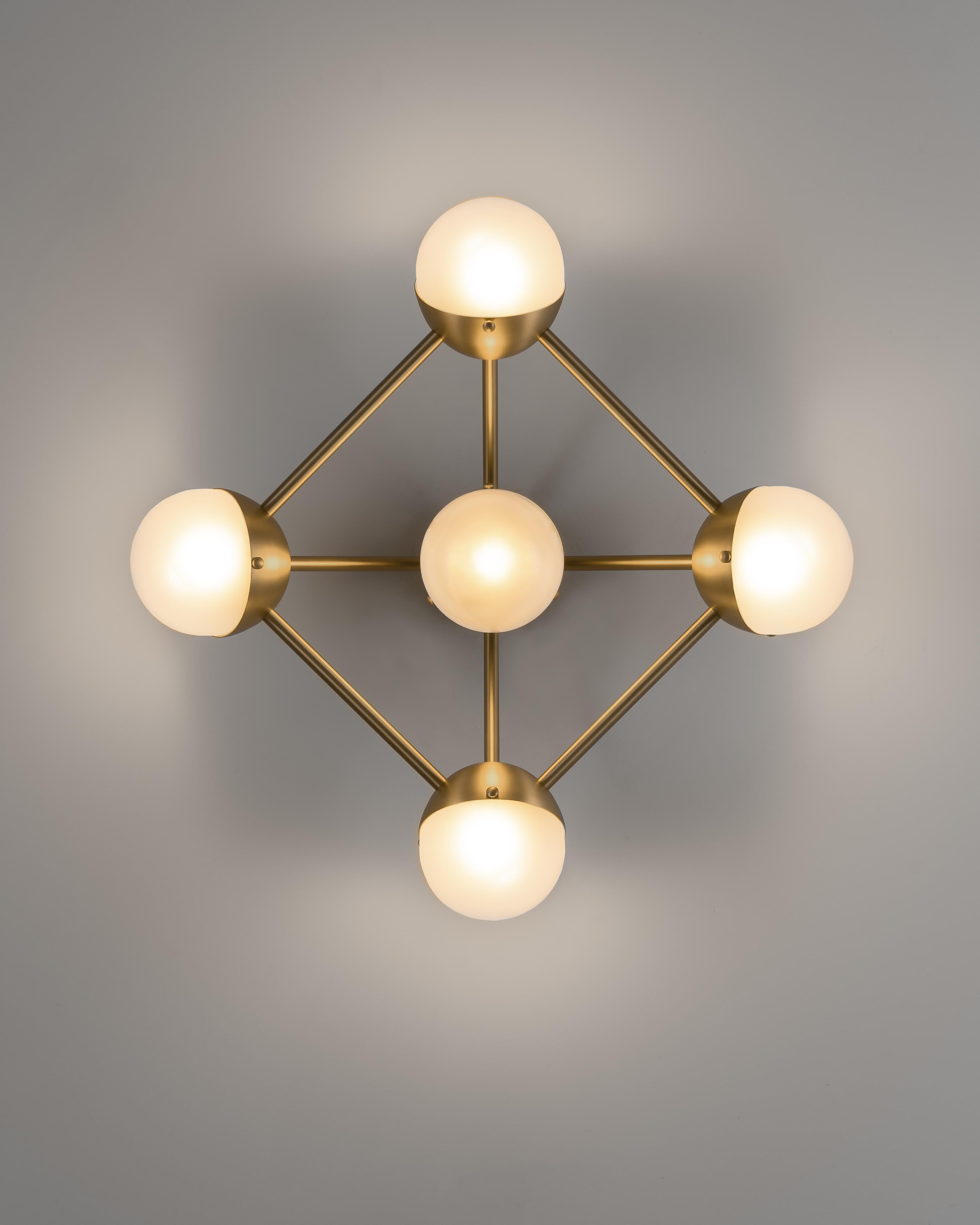 Molecule 5 Wall Sconce by Schwung.
Dimensions: W 58.4 x D 22.4 x H 58.4 cm.
Materials: Brass, Glass, PN finish.
Also Available: Black Gunmetal.

Light Source

LED Bulb (included): 5 x 5 W
Max Wattage: 5 x 10 W
Total Lumens: 2250-2500