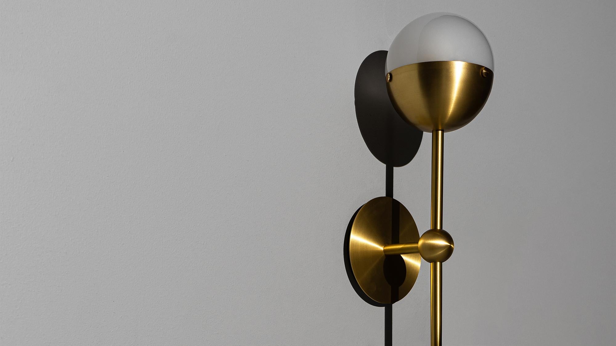 Recalling the basic elements of matter, this wall-mounted molecular model is composed of brass connections. A single bulb is amplified by borosilicate glass to light up spaces large or small.

Available in our three signature finishes: Lacquered