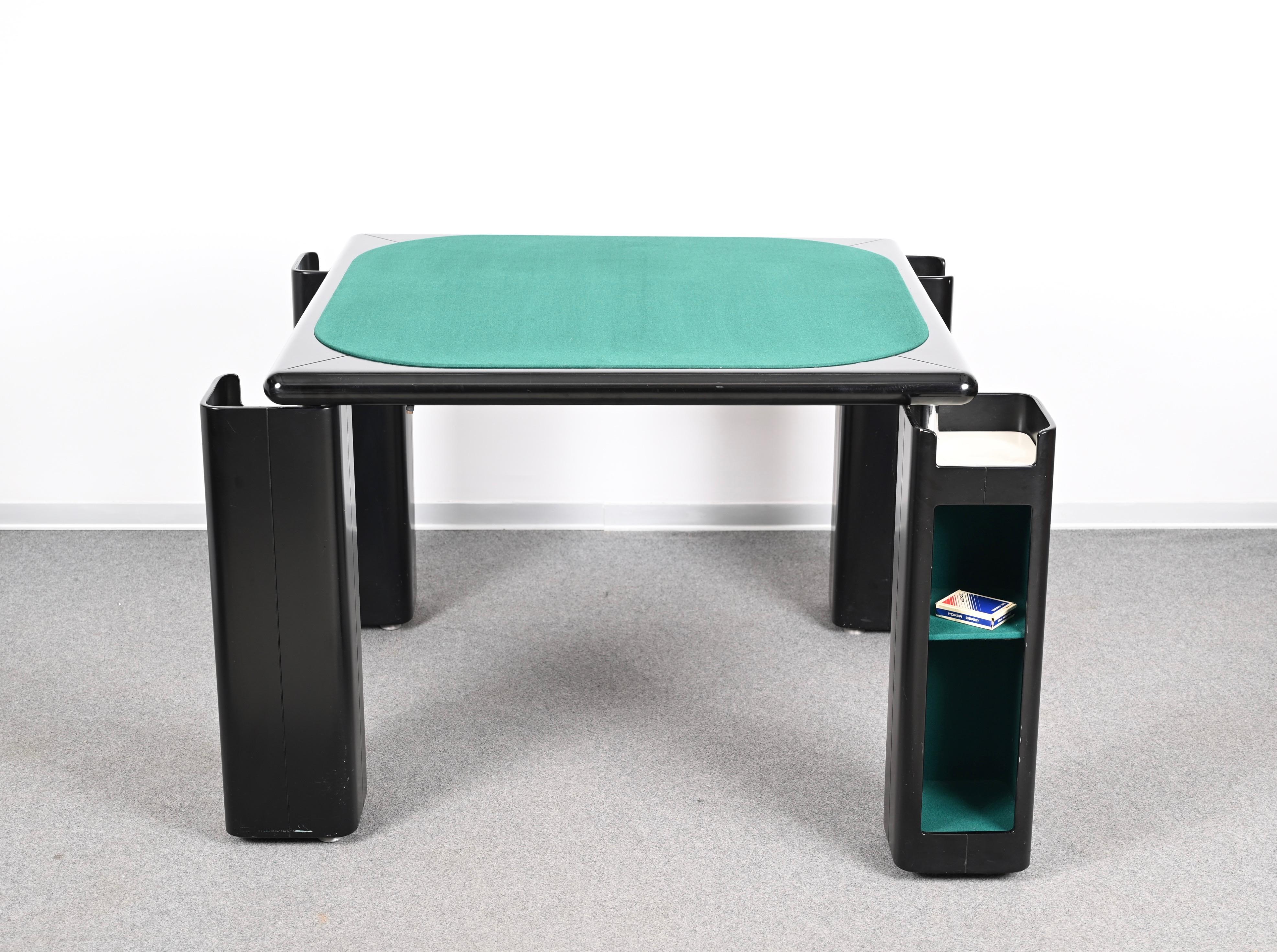 Wonderful midcentury complete set including a game table and four chairs. Pierluigi Molinari designed these pieces in Italy during the 1970s for Pozzi Milano.

The table has a top in original green felt and its main structure is in glossy black