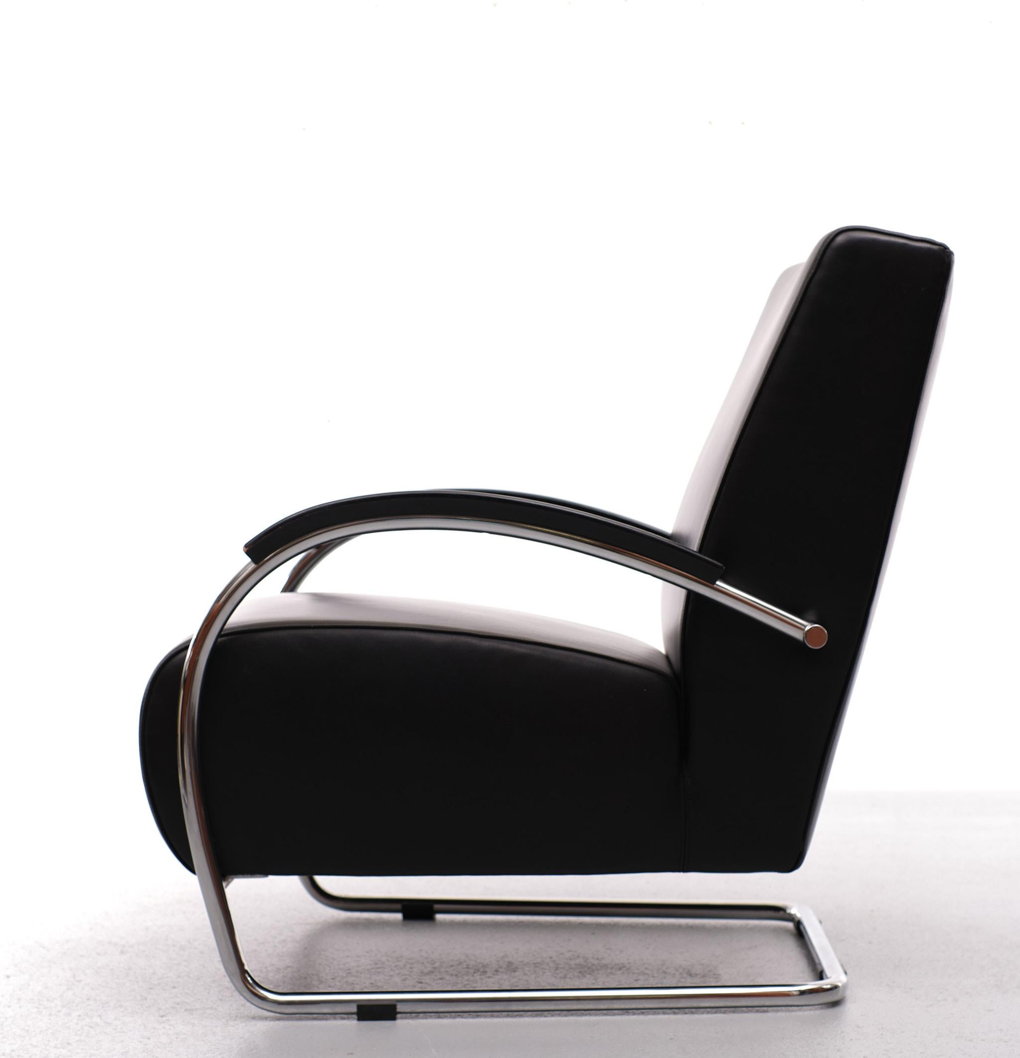 Now for sale The perfect lounge chair. Top quality black leather seating 
on a cantilever chrome frame, beautiful curved armrests. made off Black 
ebonized beechwood. Manufactured by Molinari Italy. Very good seating 
comfort. Lovely Bauhaus