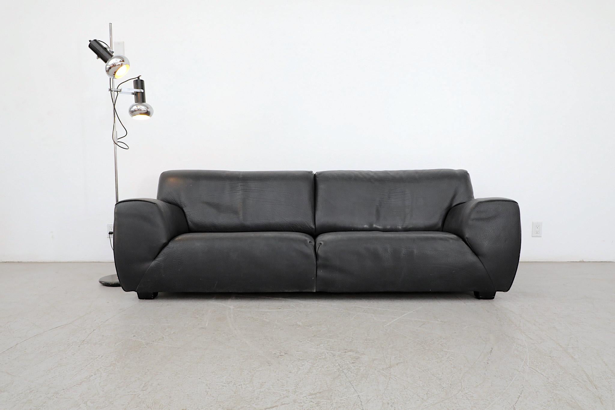 Beautiful, Mid-Century, thick black leather sofa by Italian acclaimed manufacturer Molinari. The family owned company has been in business since 1960 and is highly regarded for their well designed and expertly crafted pieces. This comfy and well