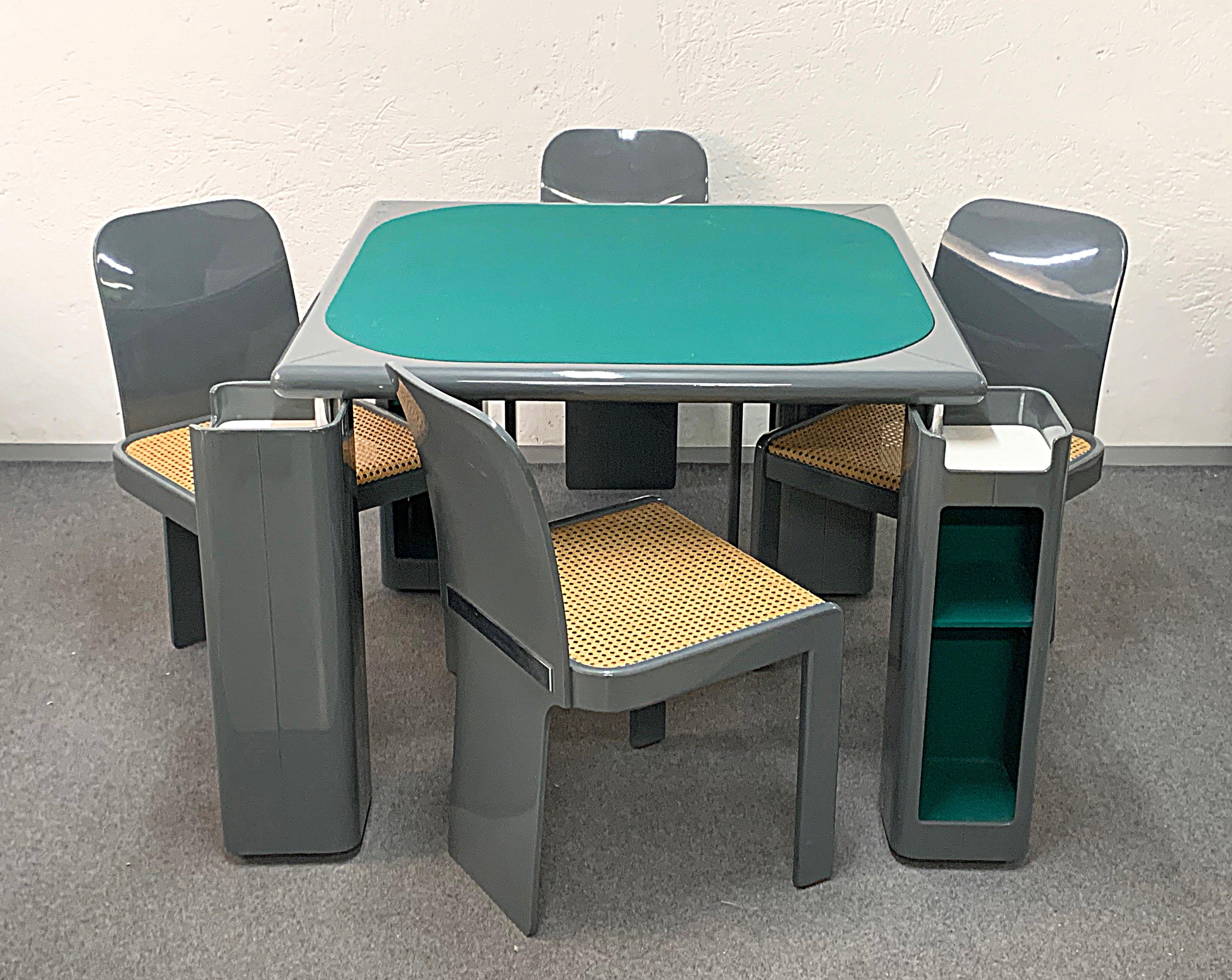 Wonderful midcentury complete set including a game table and four chairs designed in Italy during the 1970s by Pierluigi Molinari for Pozzi Milano.

The table has a top in original green felt and its main structure is in glossy gray lacquered
