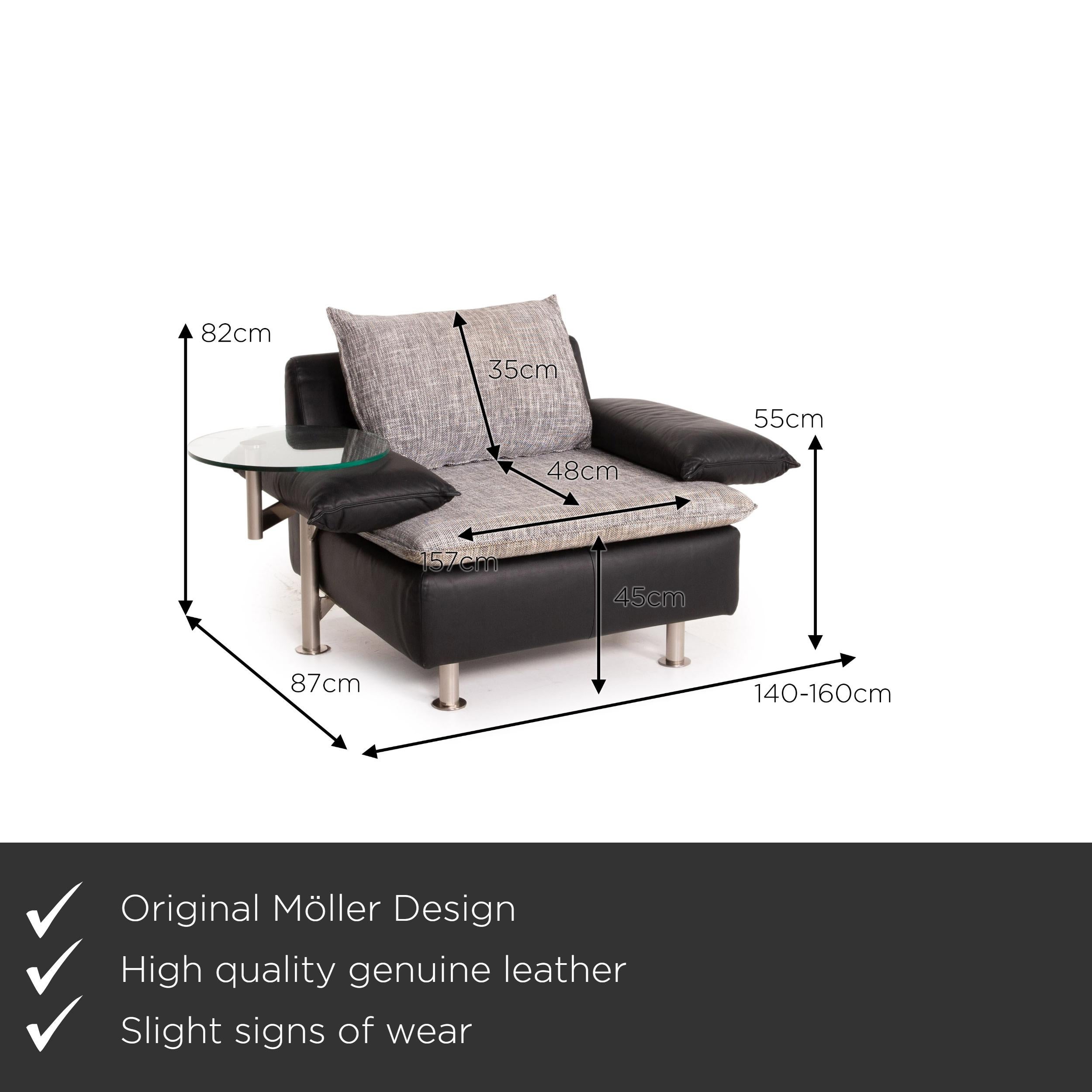 We present to you a Möller Design Tayo leather fabric armchair black gray incl. Glass shelf.
 

 Product measurements in centimeters:
 

Depth 87
Width 140
Height 82
Seat height 45
Rest height 55
Seat depth 48
Seat width 157
Back height