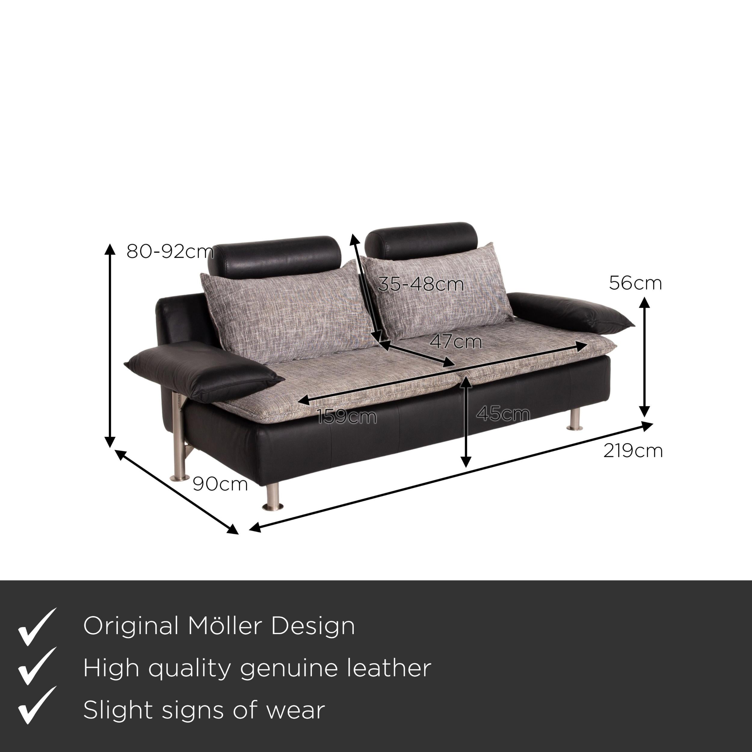 We present to you a Möller Design Tayo leather sofa black two-seat couch.

 

 Product measurements in centimeters:
 

 Depth 90
Width 219
 Height 80
 Seat height 45
 Rest height 56
 Seat depth 47
 Seat width 159
 Back height 35.